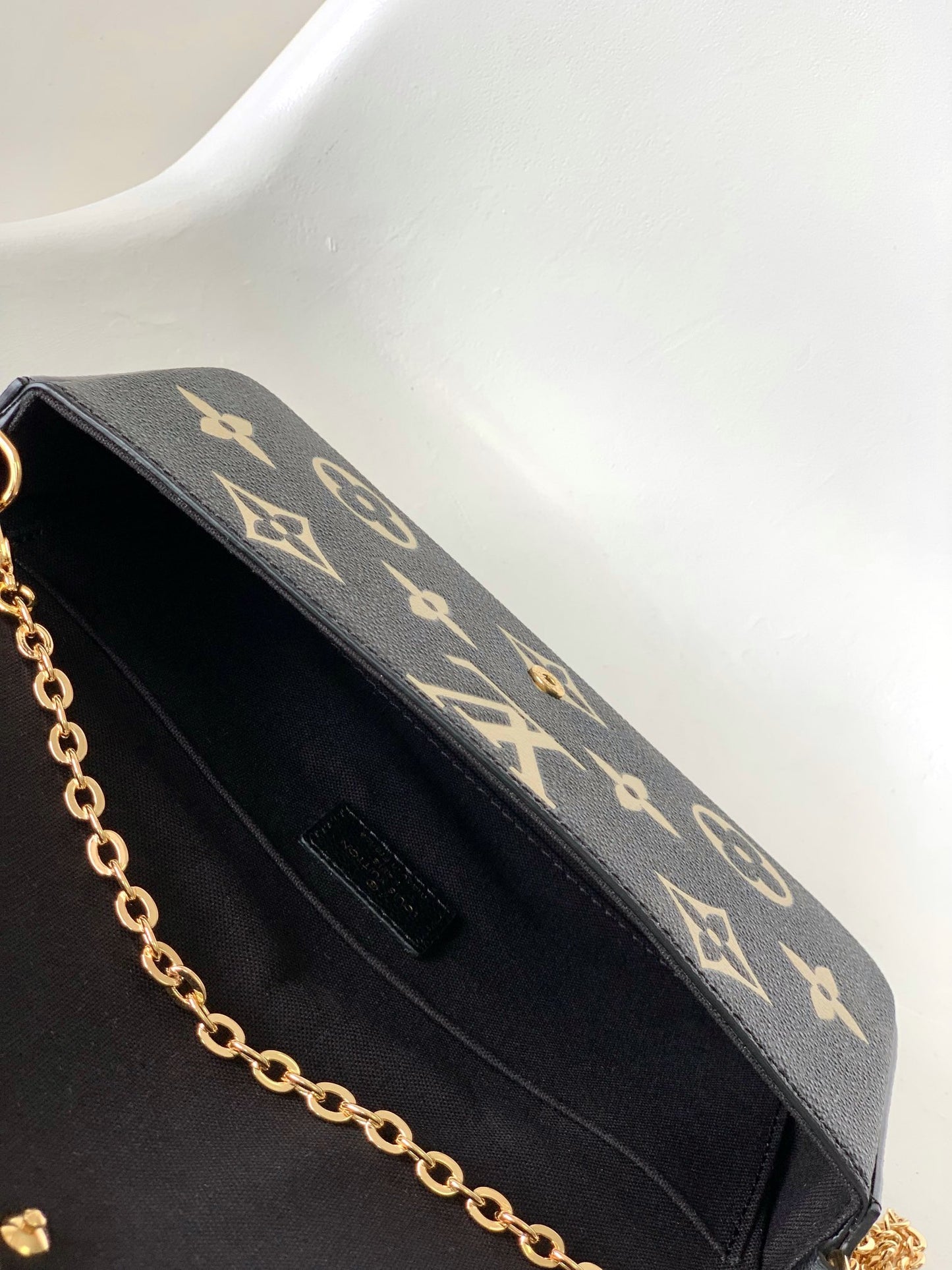 Louis Vuitton Elegant Black Chain Shoulder Bag with Gold Monogram Print