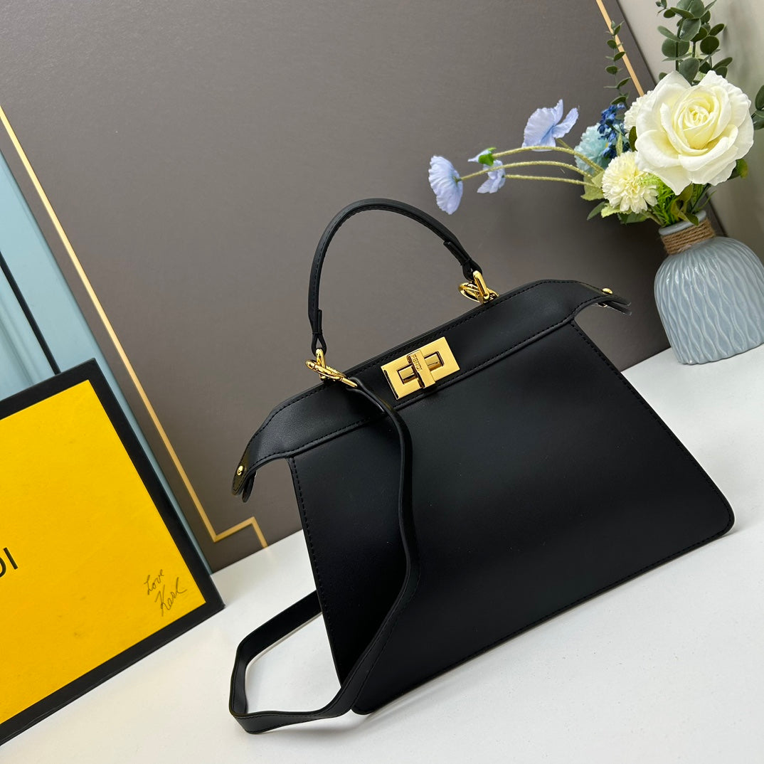 Elegant Black Structured Handbag with Gold Hardware and Shoulder Strap - 27cm x 21cm x 9cm