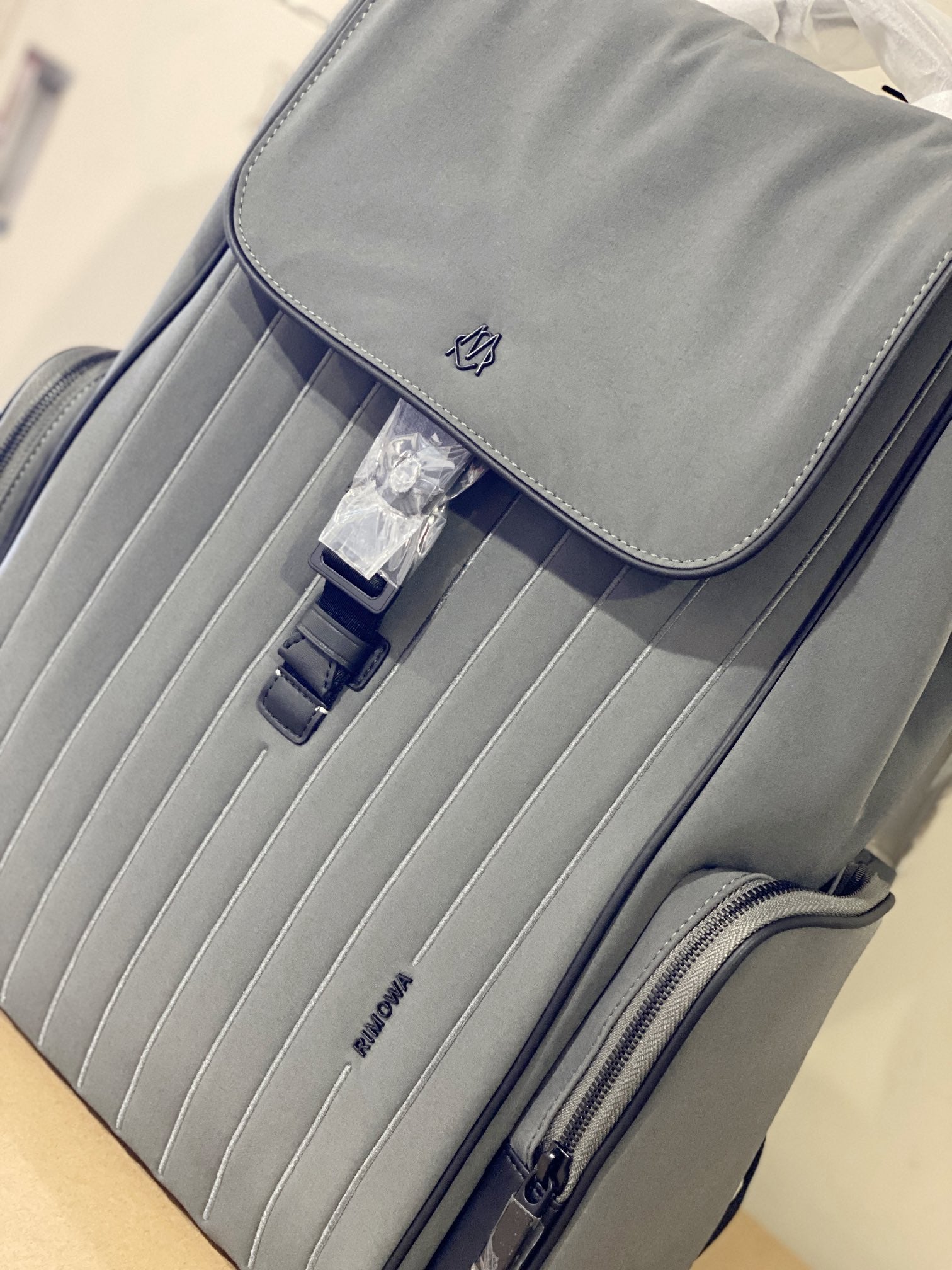 Grey Minimalist Flap Backpack with Ribbed Front Panel and Buckle