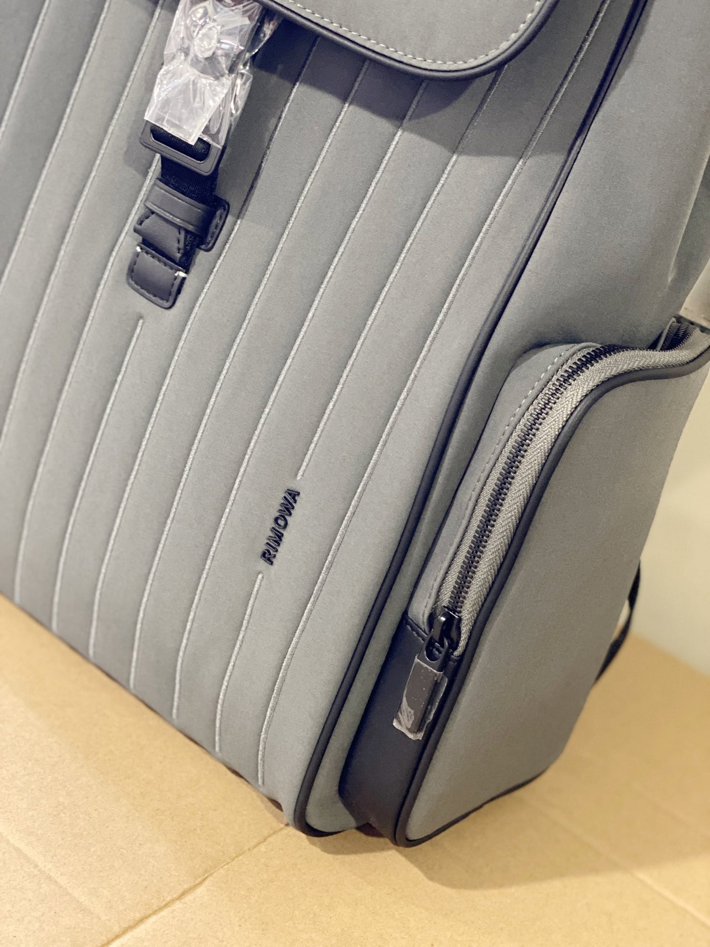 Grey Minimalist Flap Backpack with Ribbed Front Panel and Buckle