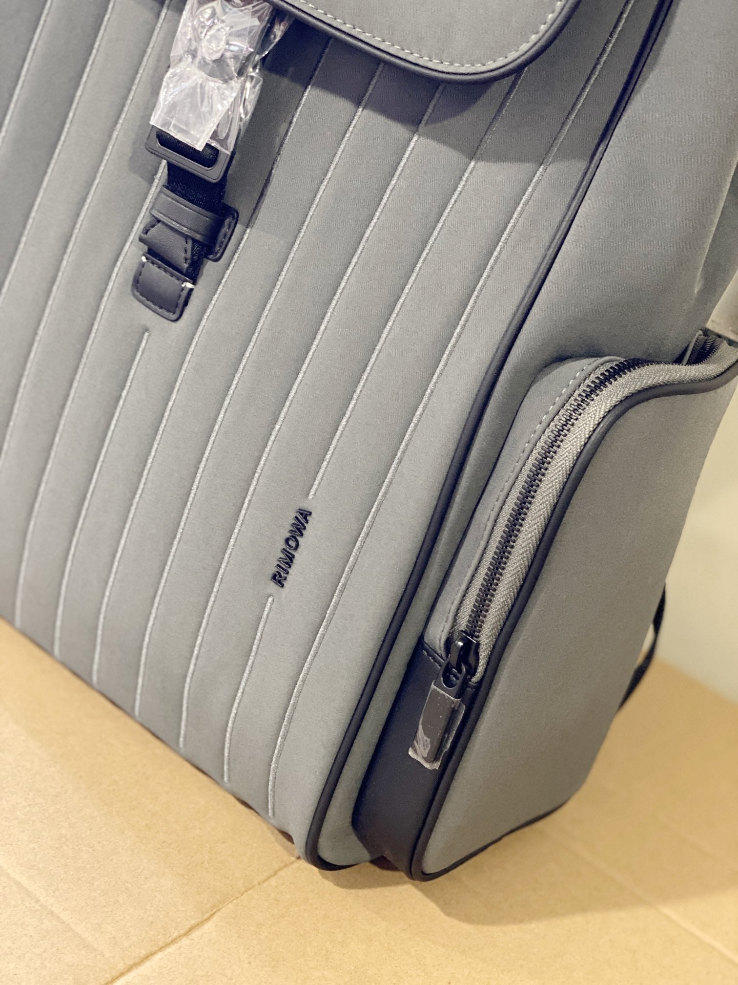 Grey Minimalist Flap Backpack with Ribbed Front Panel and Buckle