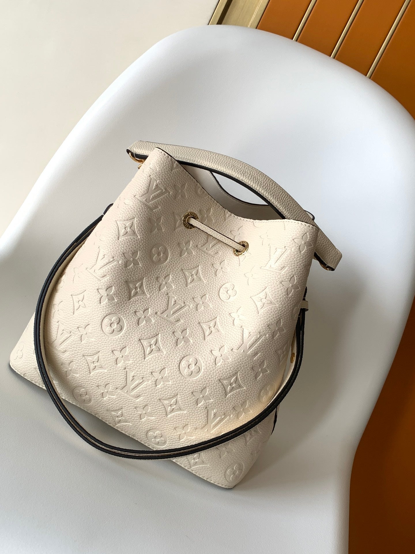Louis Vuitton Elegant Cream Perforated Leather Drawstring Bucket Bag