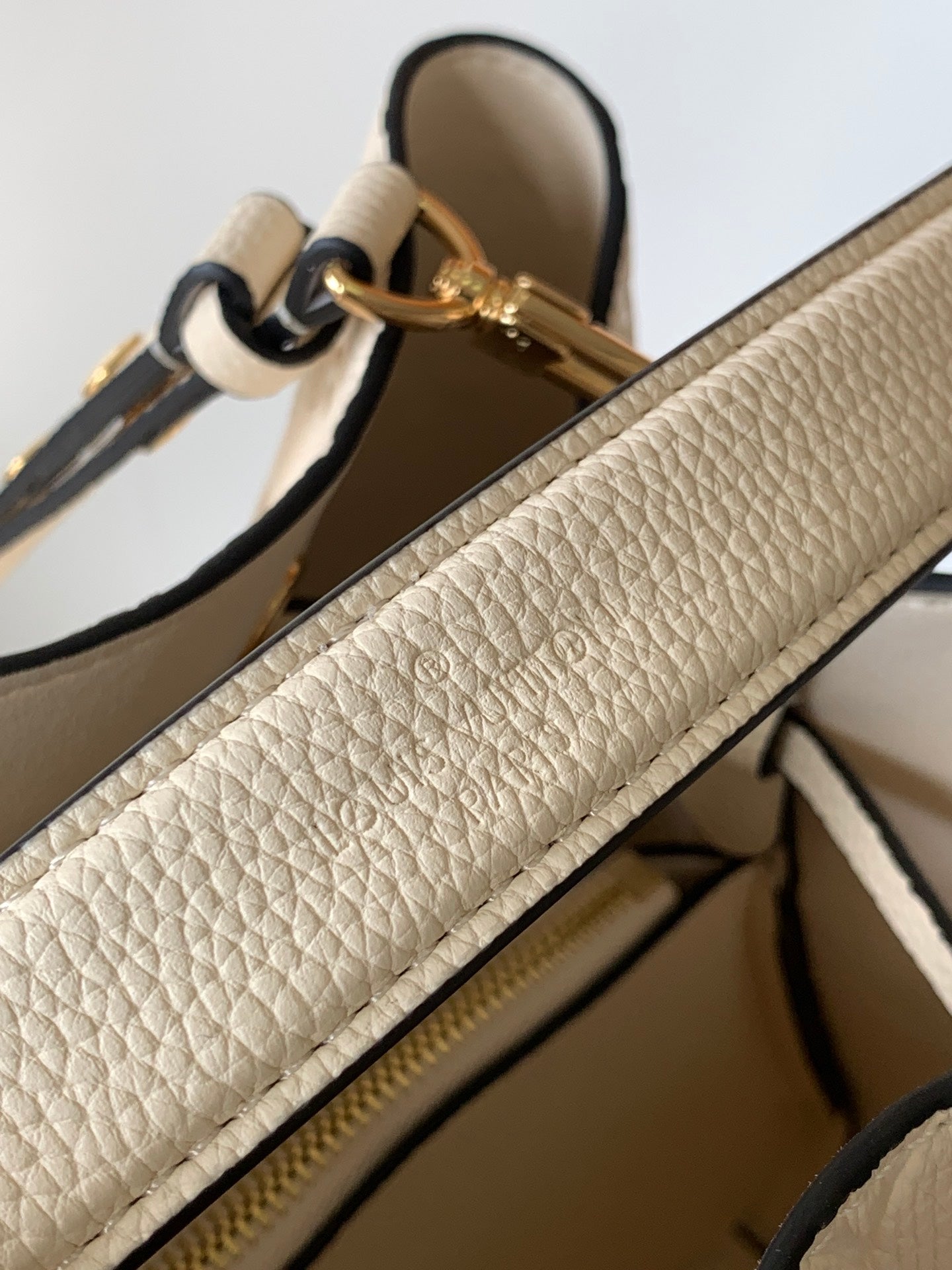 Louis Vuitton Elegant Cream Perforated Leather Drawstring Bucket Bag