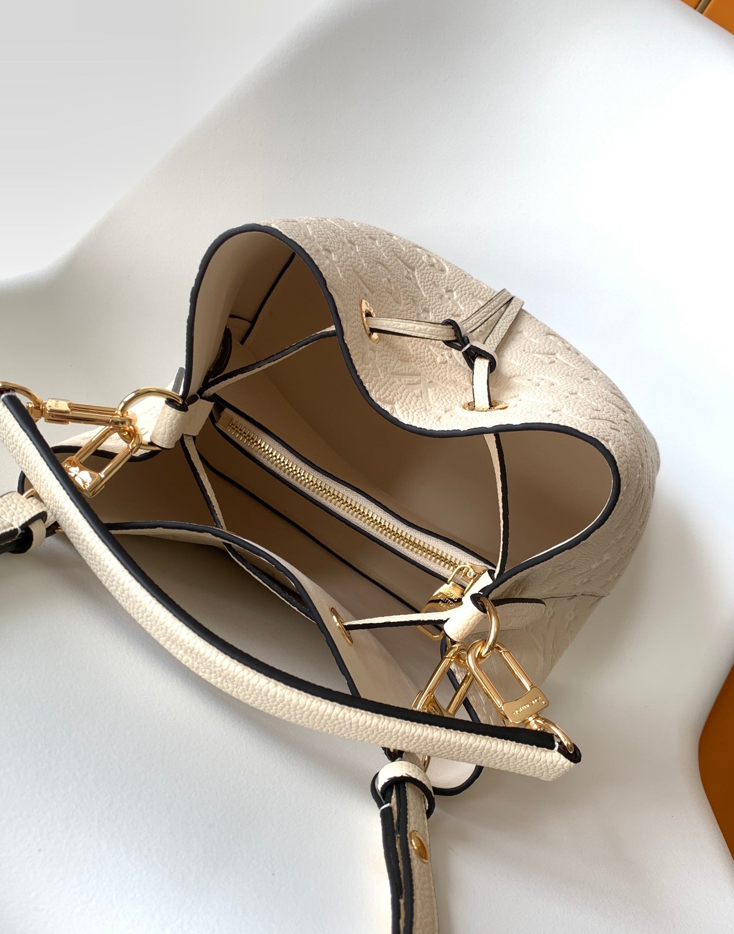 Louis Vuitton Elegant Cream Perforated Leather Drawstring Bucket Bag