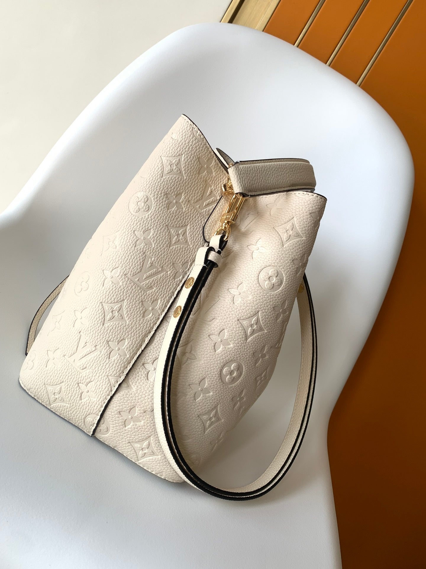 Louis Vuitton Elegant Cream Perforated Leather Drawstring Bucket Bag