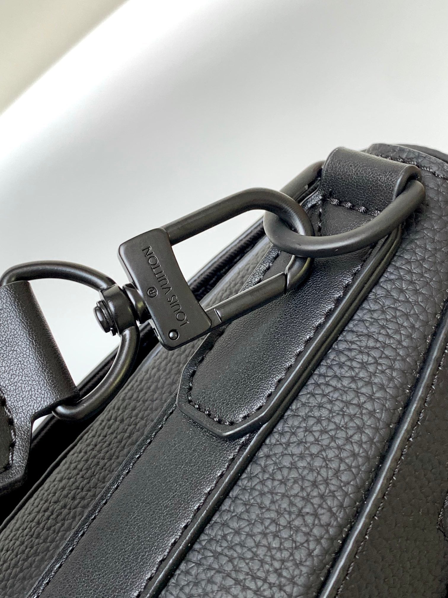 Louis Vuitton Minimalist Black Leather Messenger Bag with Wide Crossbody Strap