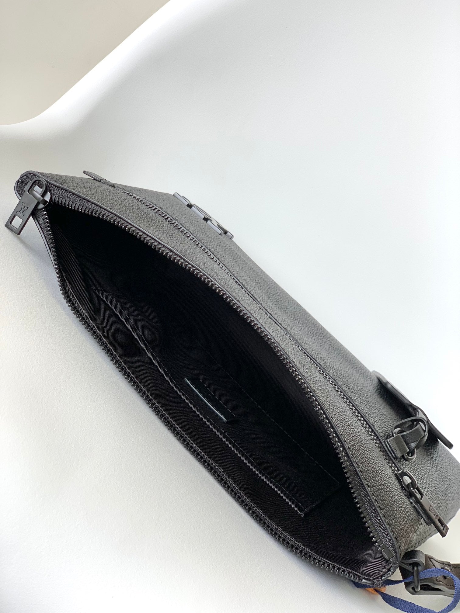 Louis Vuitton Black Textured Leather Clutch Bag with Wristlet Strap and Front Pocket