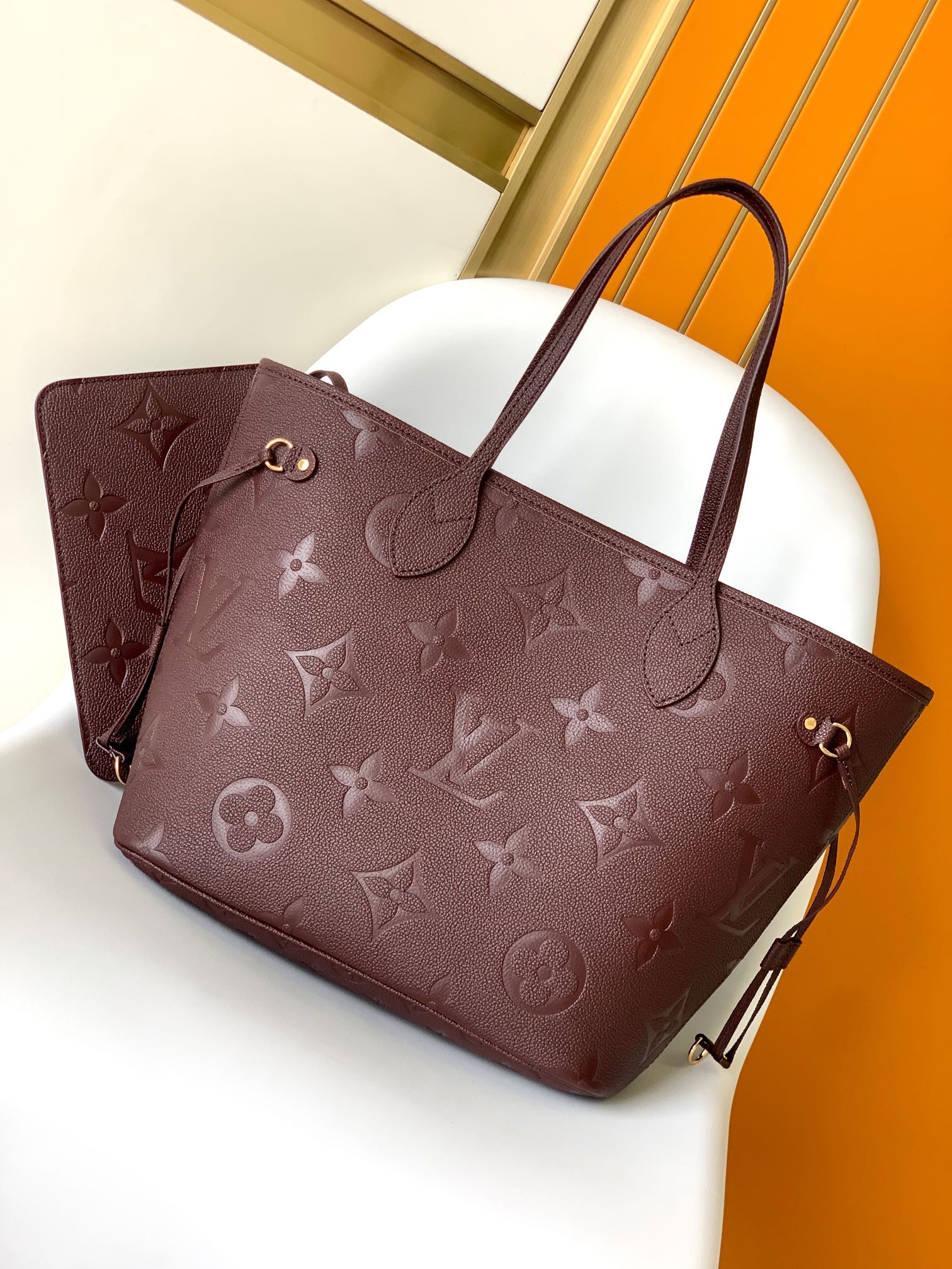 Louis Vuitton Elegant Burgundy Embossed Leather Tote Bag with Side Drawstrings