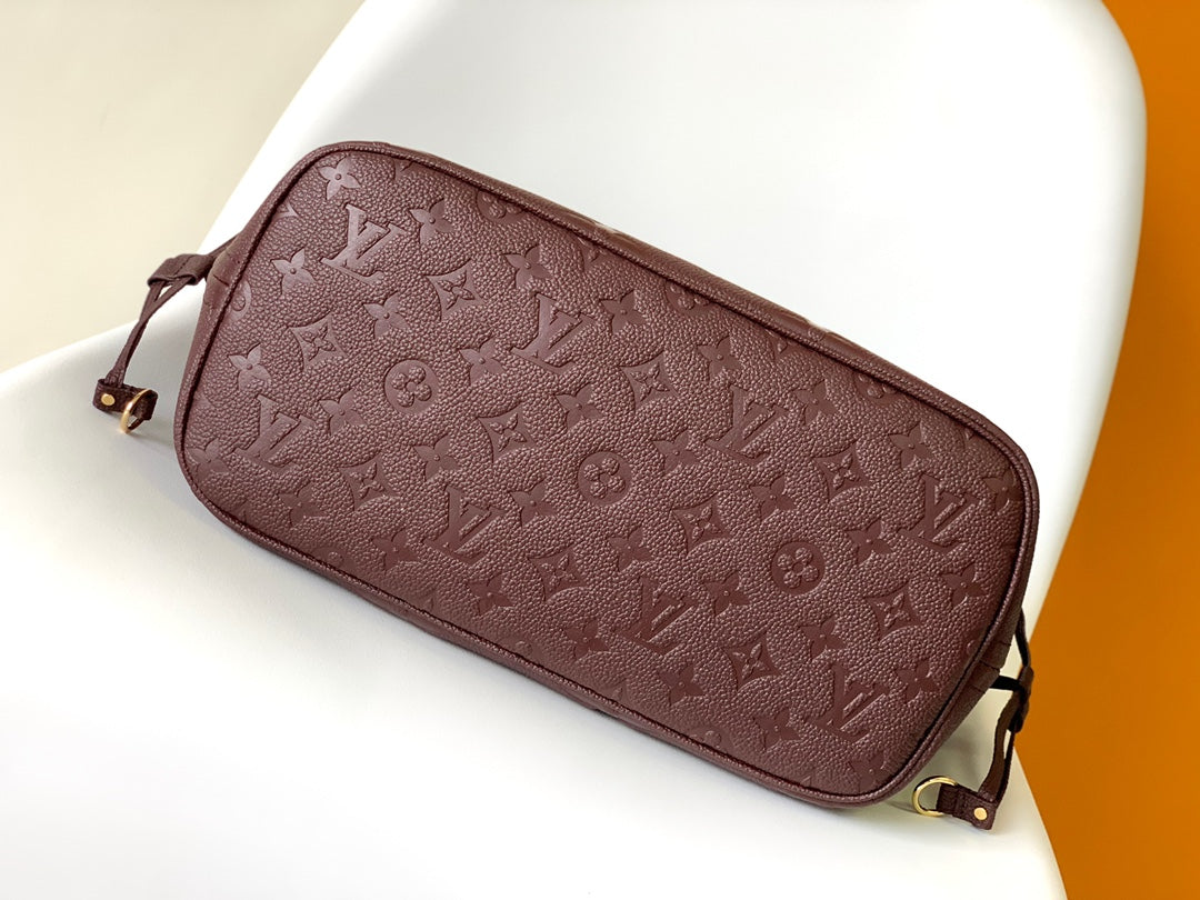 Louis Vuitton Elegant Burgundy Embossed Leather Tote Bag with Side Drawstrings