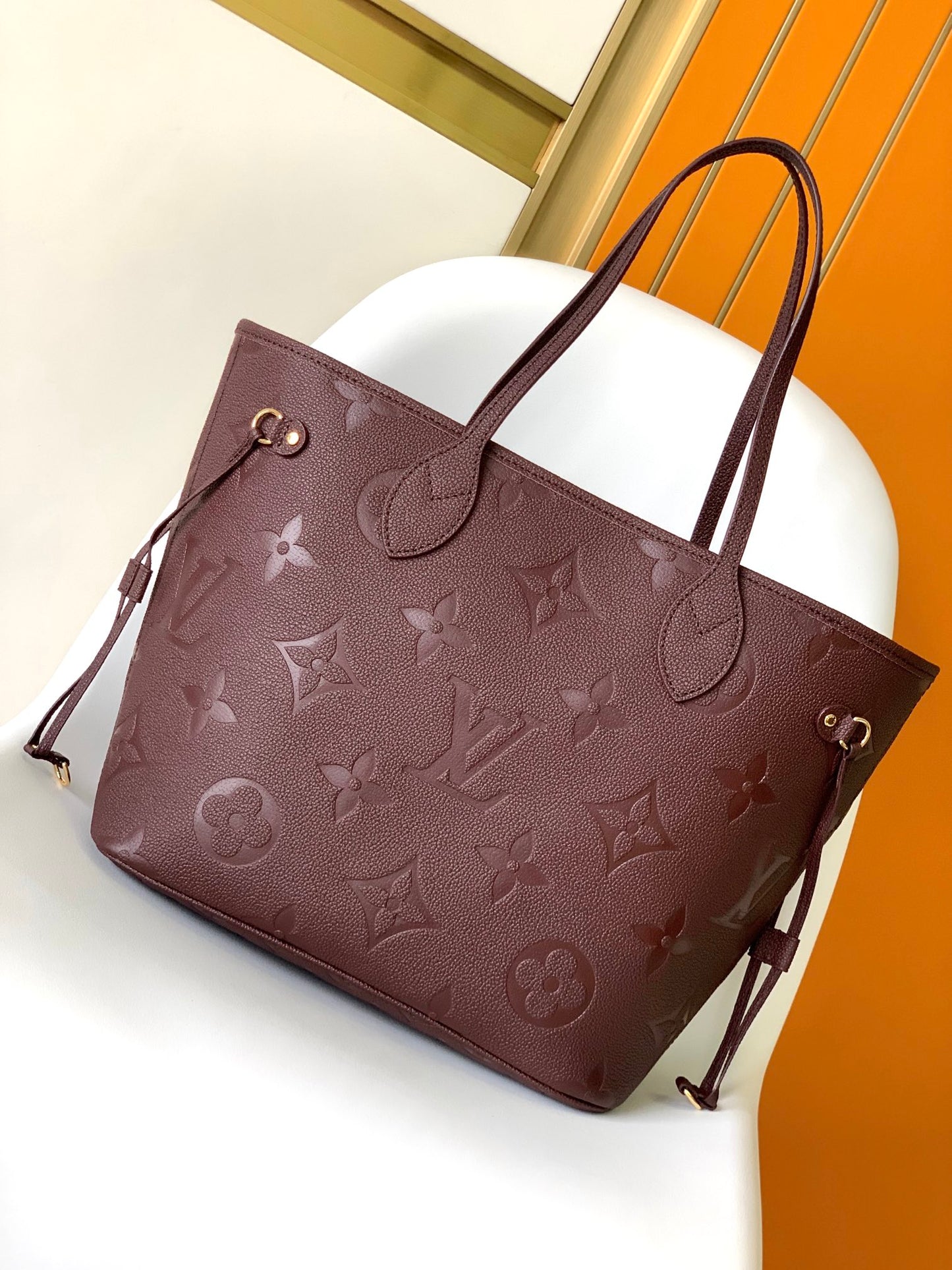 Louis Vuitton Elegant Burgundy Embossed Leather Tote Bag with Side Drawstrings
