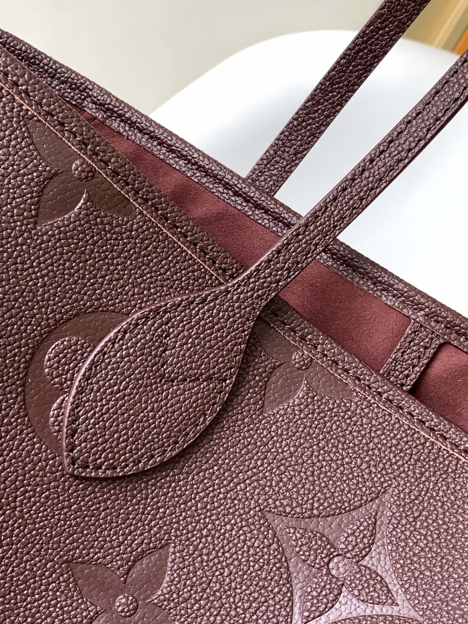 Louis Vuitton Elegant Burgundy Embossed Leather Tote Bag with Side Drawstrings