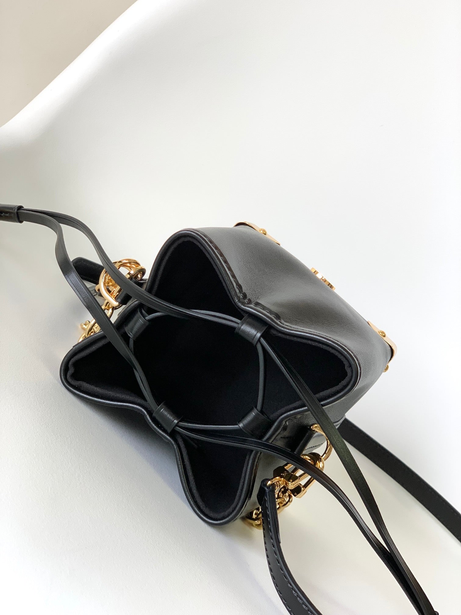 Louis Vuitton Luxury Black Leather Bucket Crossbody Bag with Gold Hardware