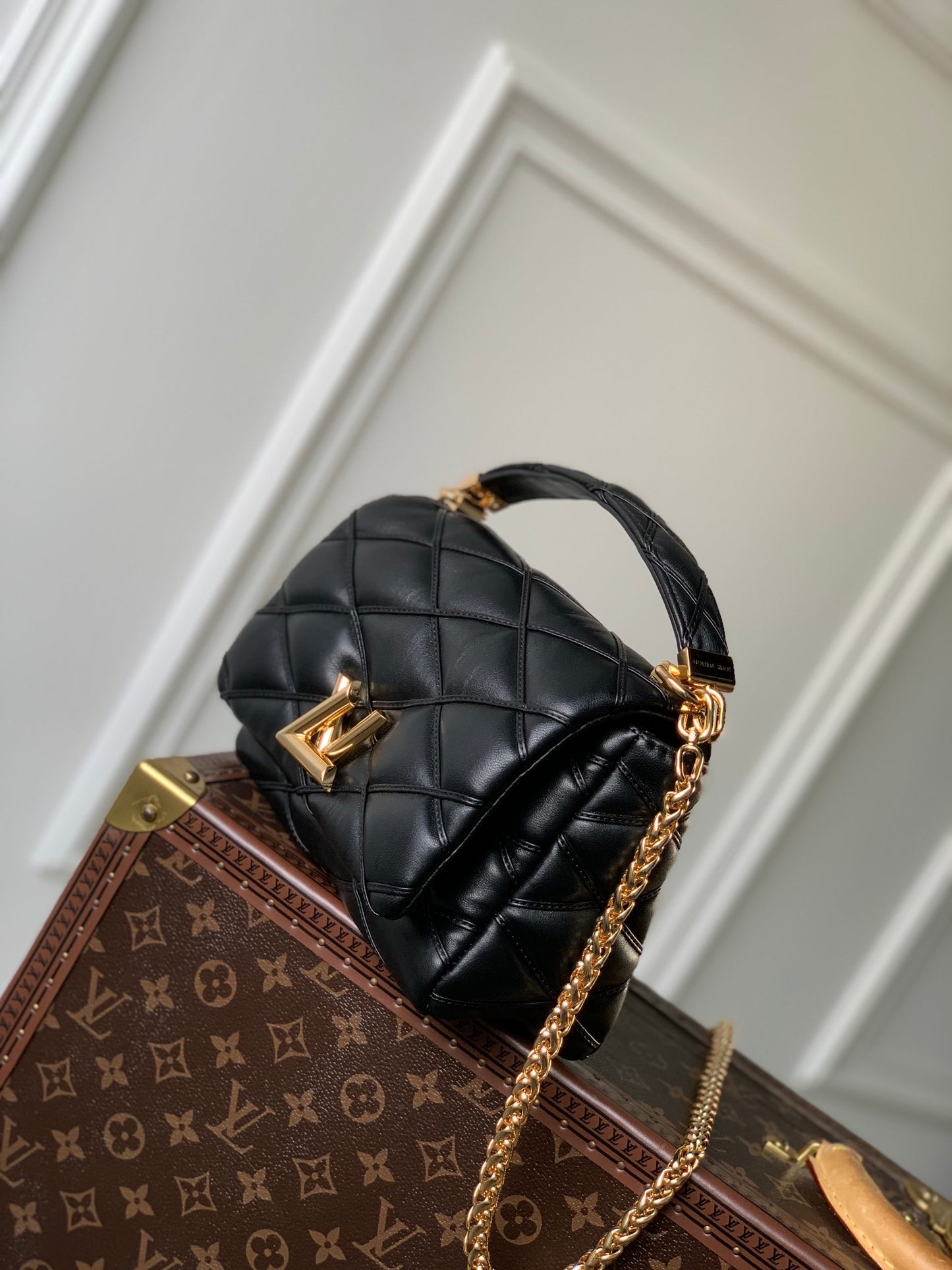Louis Vuitton Quilted Black Leather Top Handle Handbag with Gold Metal Clasp