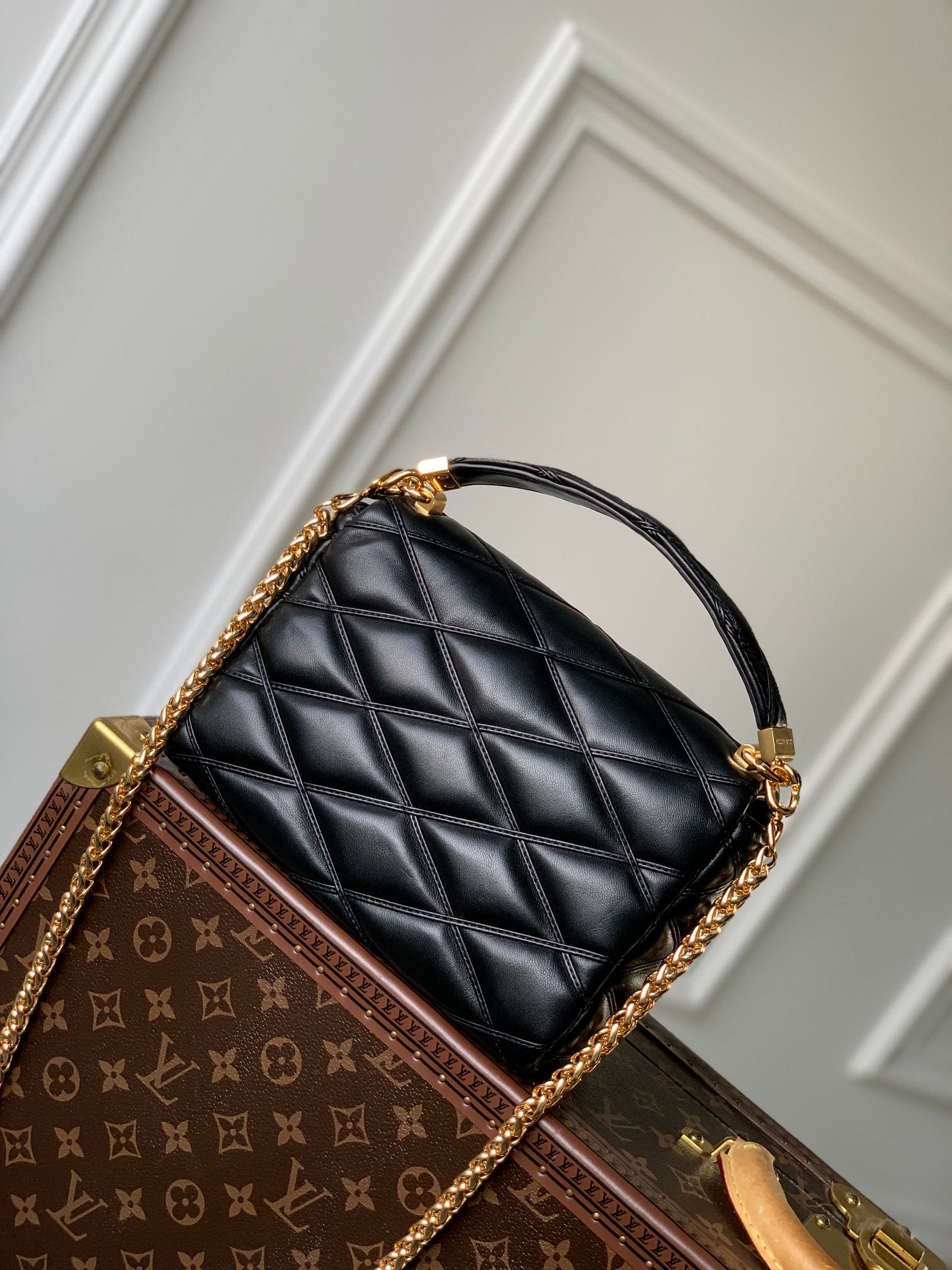 Louis Vuitton Quilted Black Leather Top Handle Handbag with Gold Metal Clasp