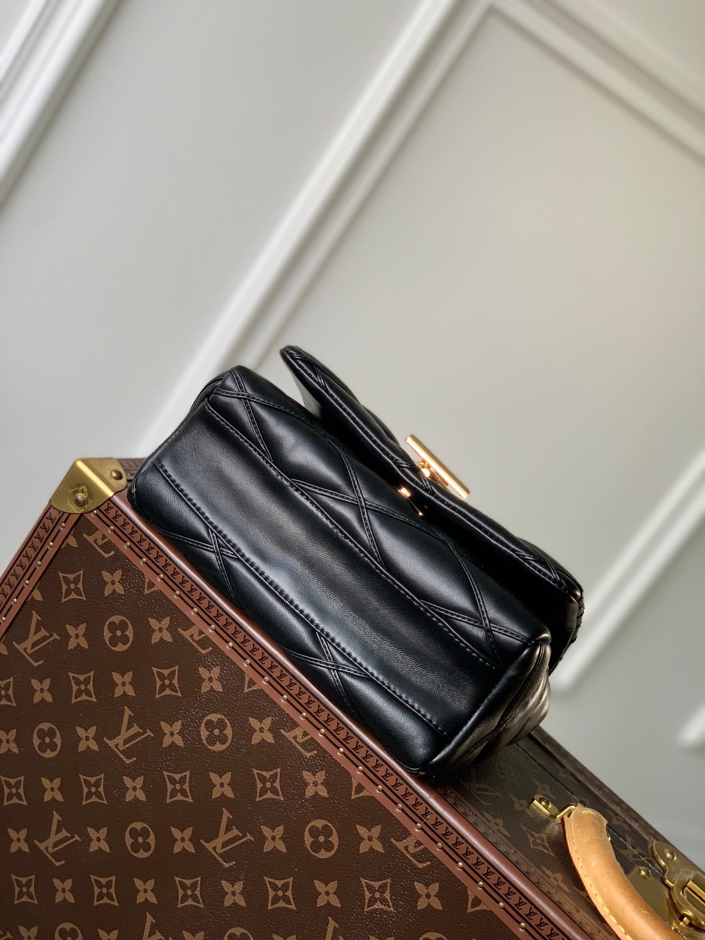Louis Vuitton Quilted Black Leather Top Handle Handbag with Gold Metal Clasp