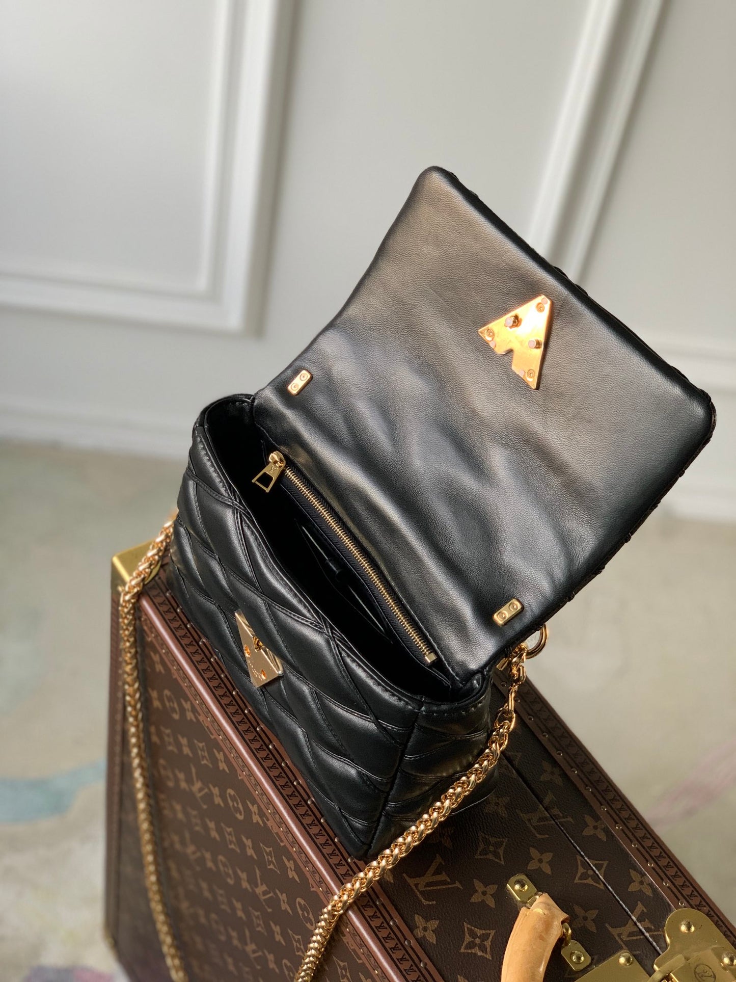 Louis Vuitton Quilted Black Leather Top Handle Handbag with Gold Metal Clasp