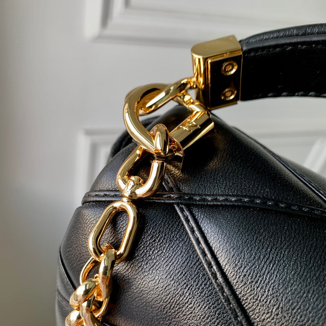 Louis Vuitton Quilted Black Leather Top Handle Handbag with Gold Metal Clasp