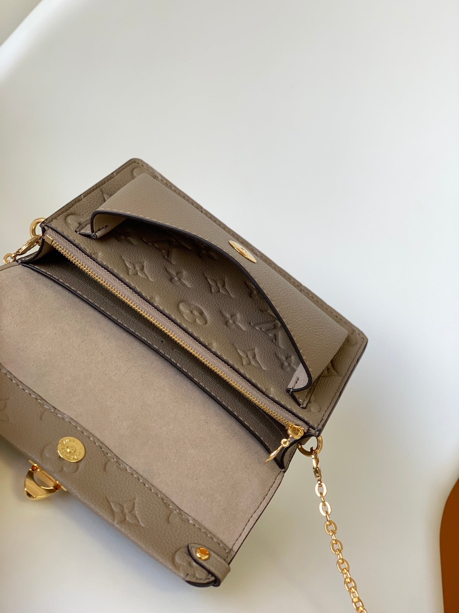 Louis Vuitton Elegant Taupe Embossed Leather Flap Handbag with Gold Chain Strap