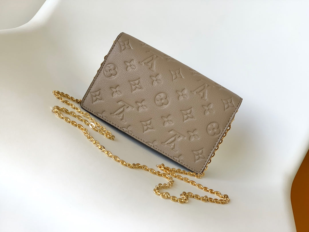 Louis Vuitton Elegant Taupe Embossed Leather Flap Handbag with Gold Chain Strap