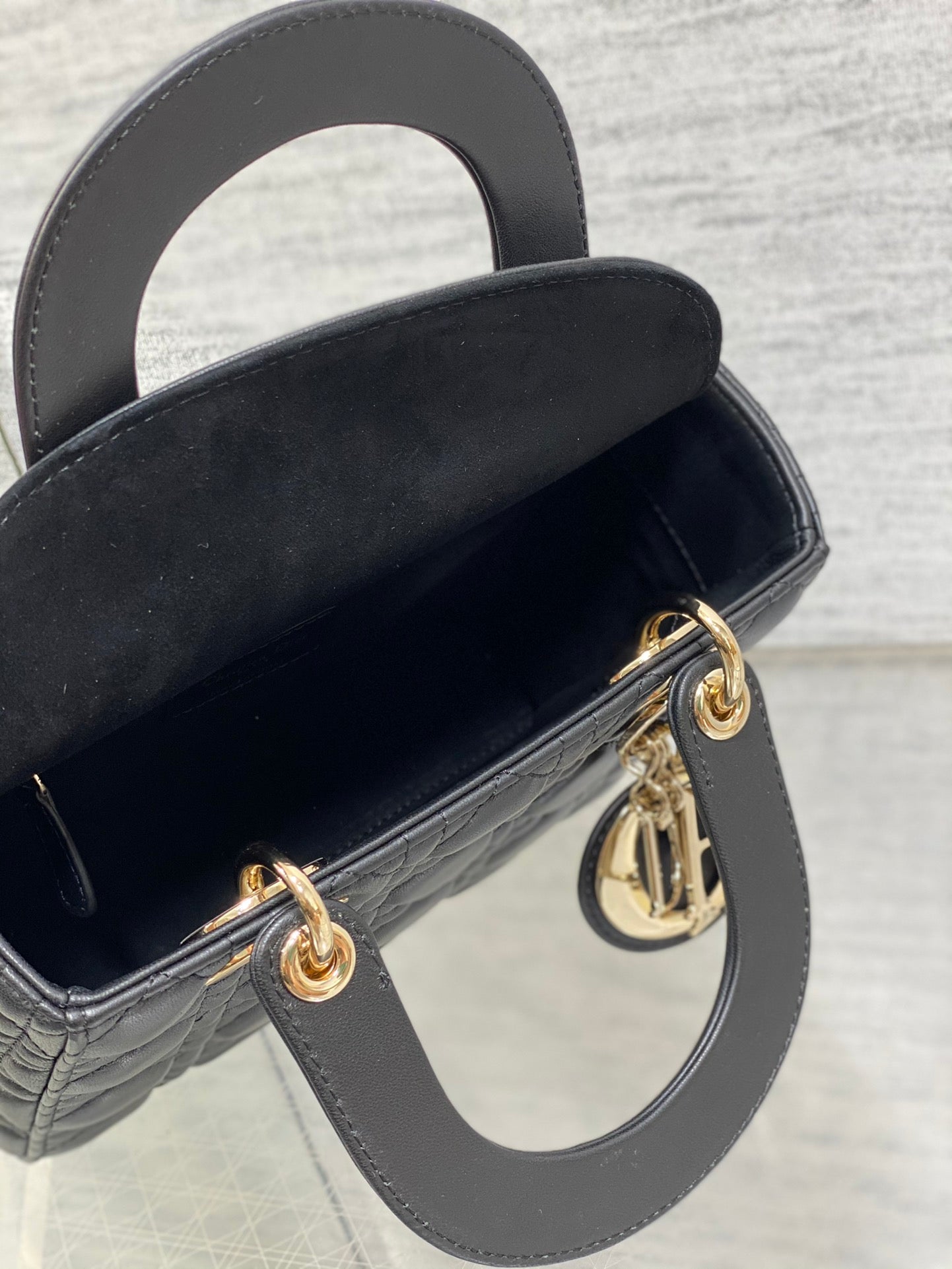 Dior Elegant Black Quilted Leather Handbag with Gold Hardware