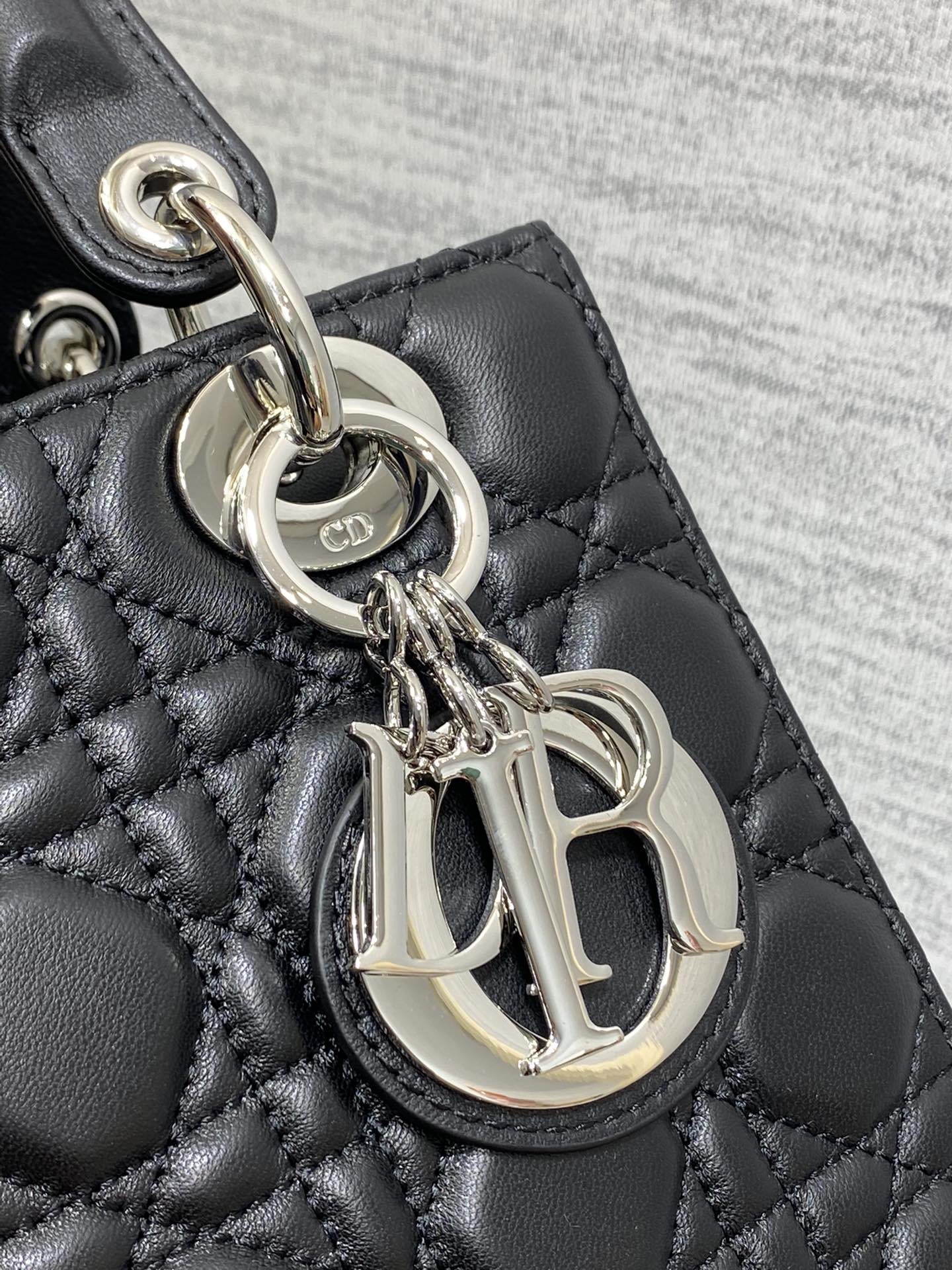 Dior Elegant Black Quilted Leather Handbag with Top Handles and Strap