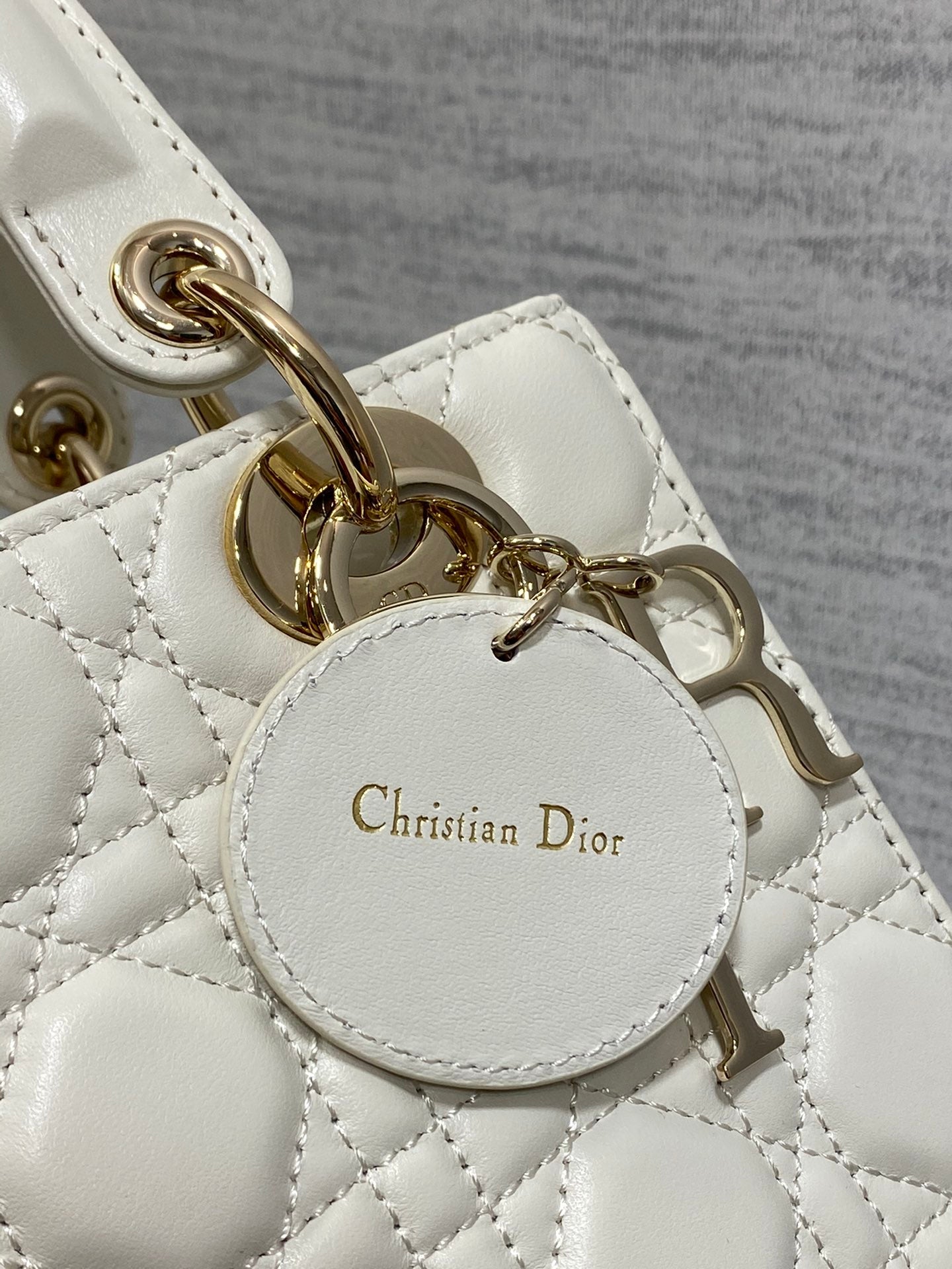 Dior Elegant White Quilted Leather Top Handle Bag with Shoulder Strap