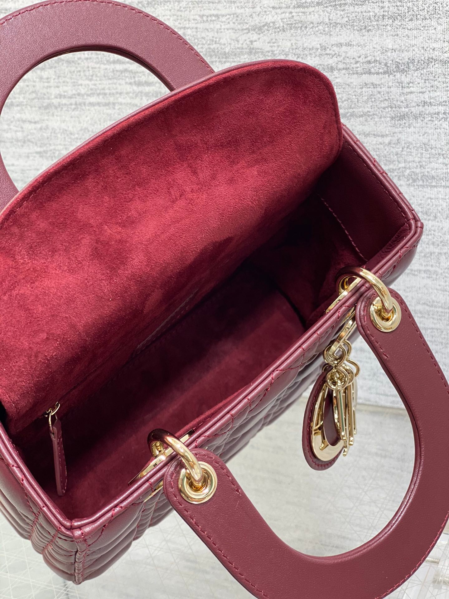 Dior Burgundy Quilted Leather Top Handle Handbag with Crossbody Strap