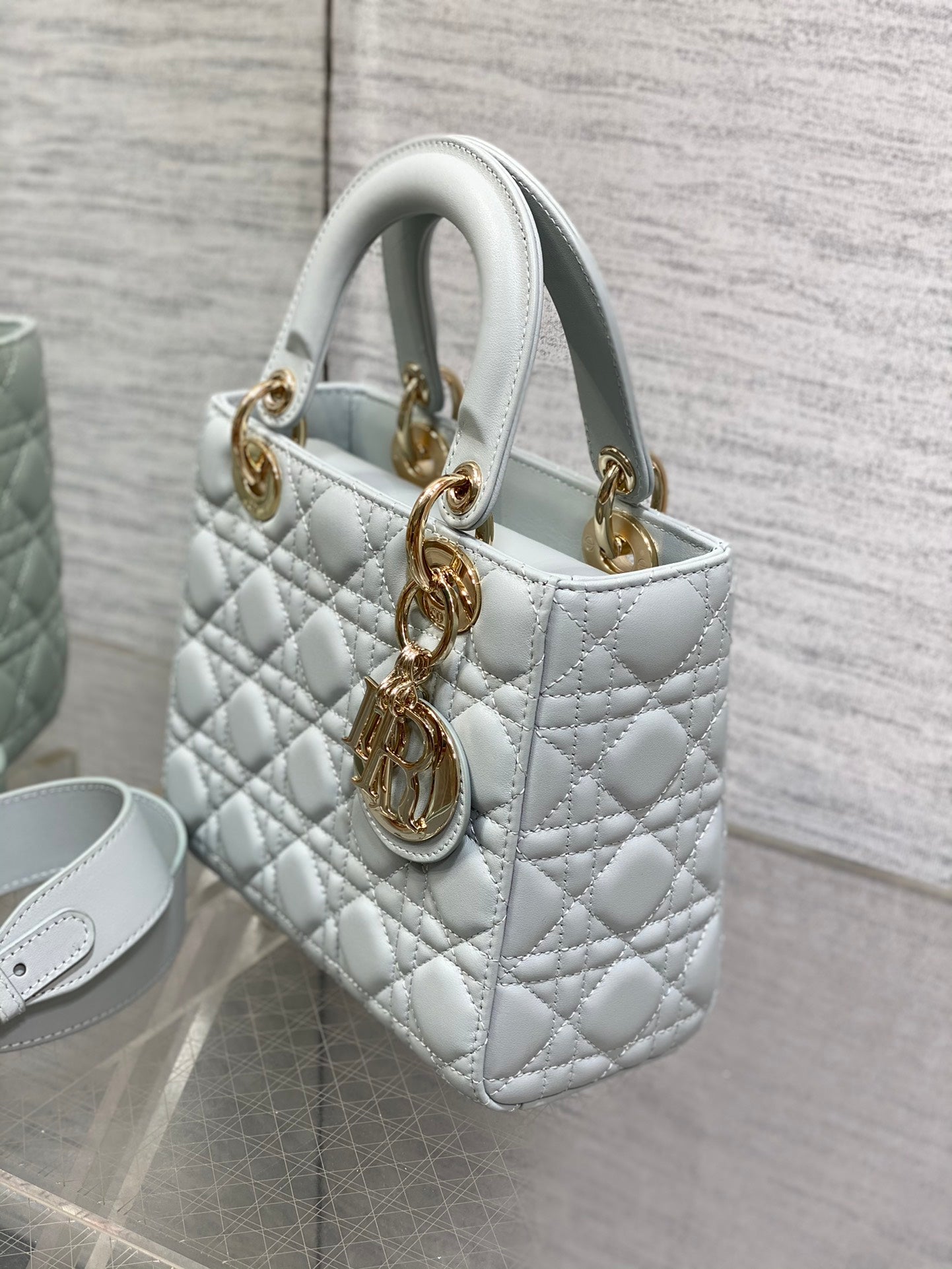 Dior Light Blue Quilted Leather Handbag with Gold Charms and Strap