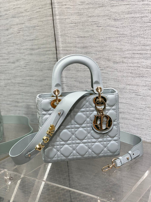 Dior Light Blue Quilted Leather Handbag with Gold Charms and Strap
