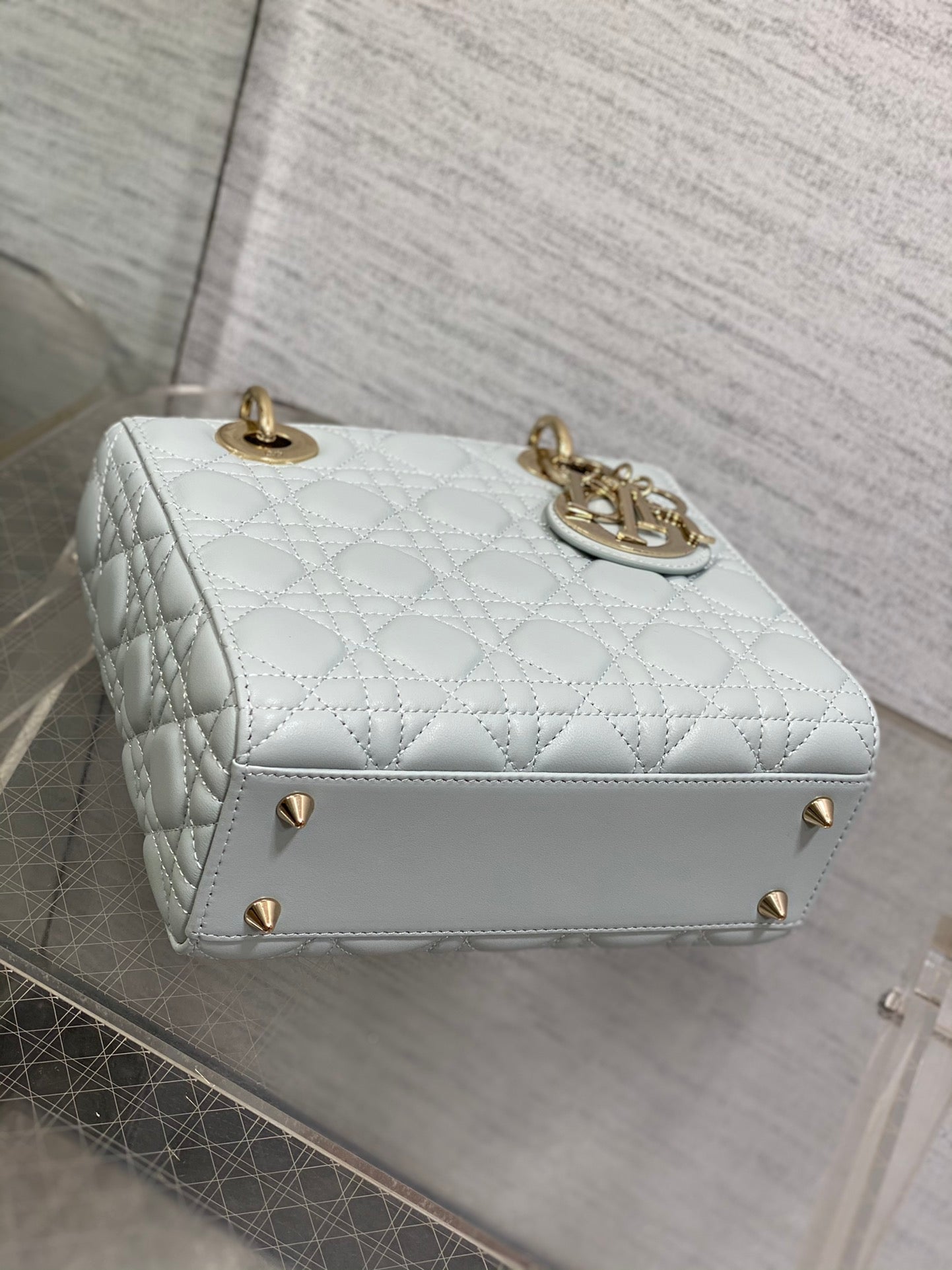 Dior Light Blue Quilted Leather Handbag with Gold Charms and Strap