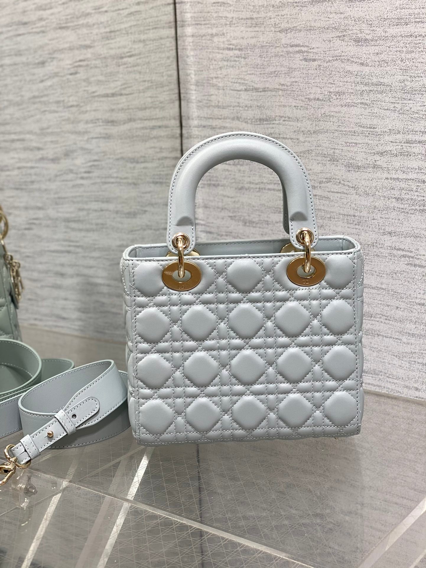 Dior Elegant Light Blue Quilted Leather Handbag with Crossbody Strap