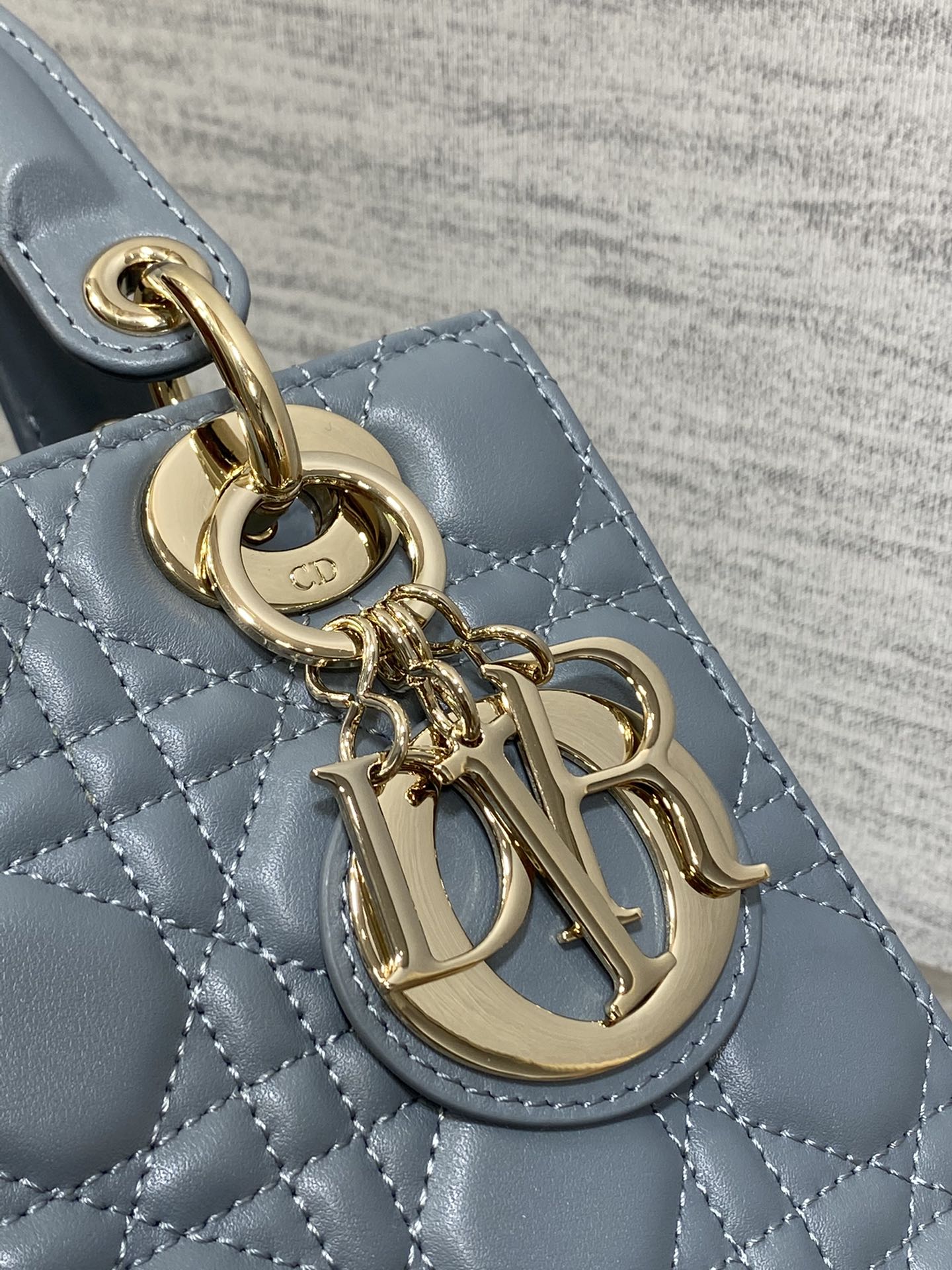 Dior Elegant Blue Quilted Leather Handbag with Top Handle and Strap