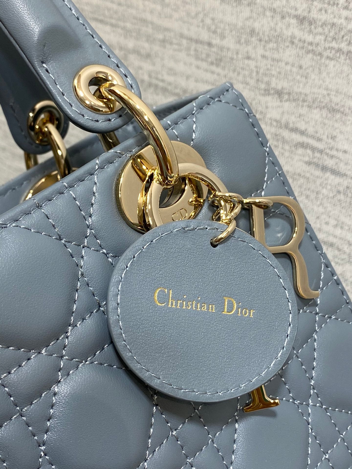 Dior Elegant Blue Quilted Leather Handbag with Top Handle and Strap
