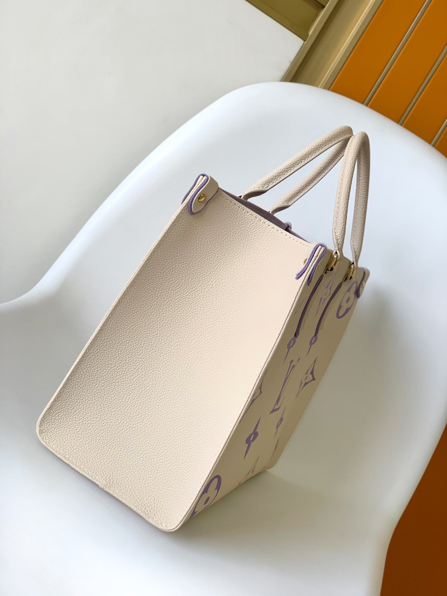 Louis Vuitton Elegant Cream Leather Tote Bag with Purple Monogram Print
