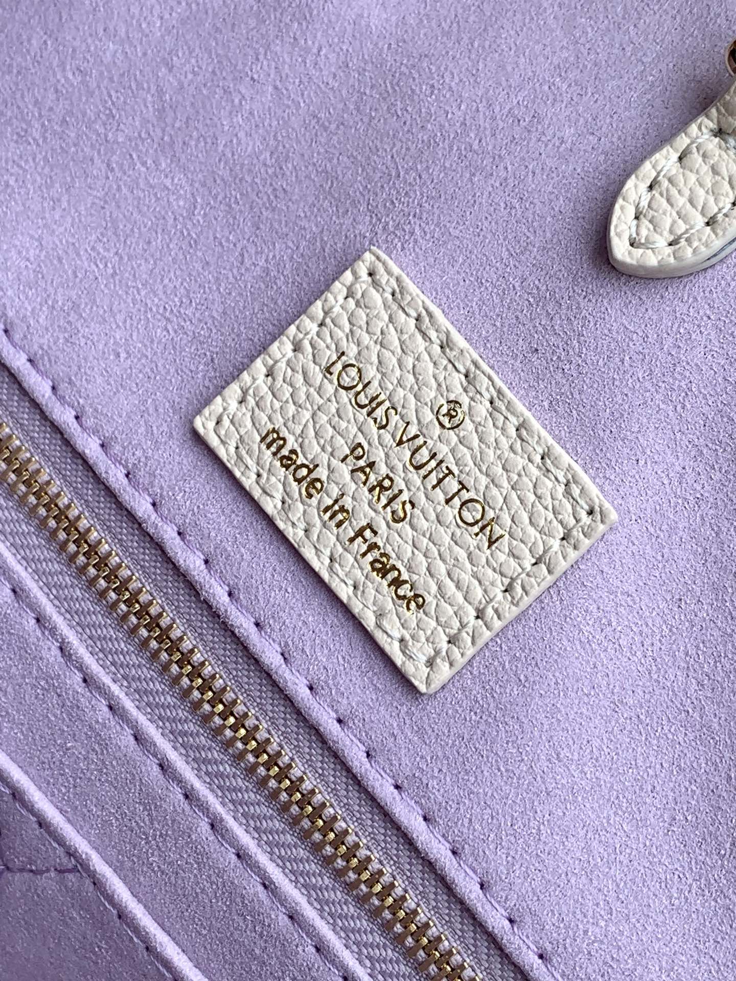 Louis Vuitton Elegant Cream Leather Tote Bag with Purple Monogram Print