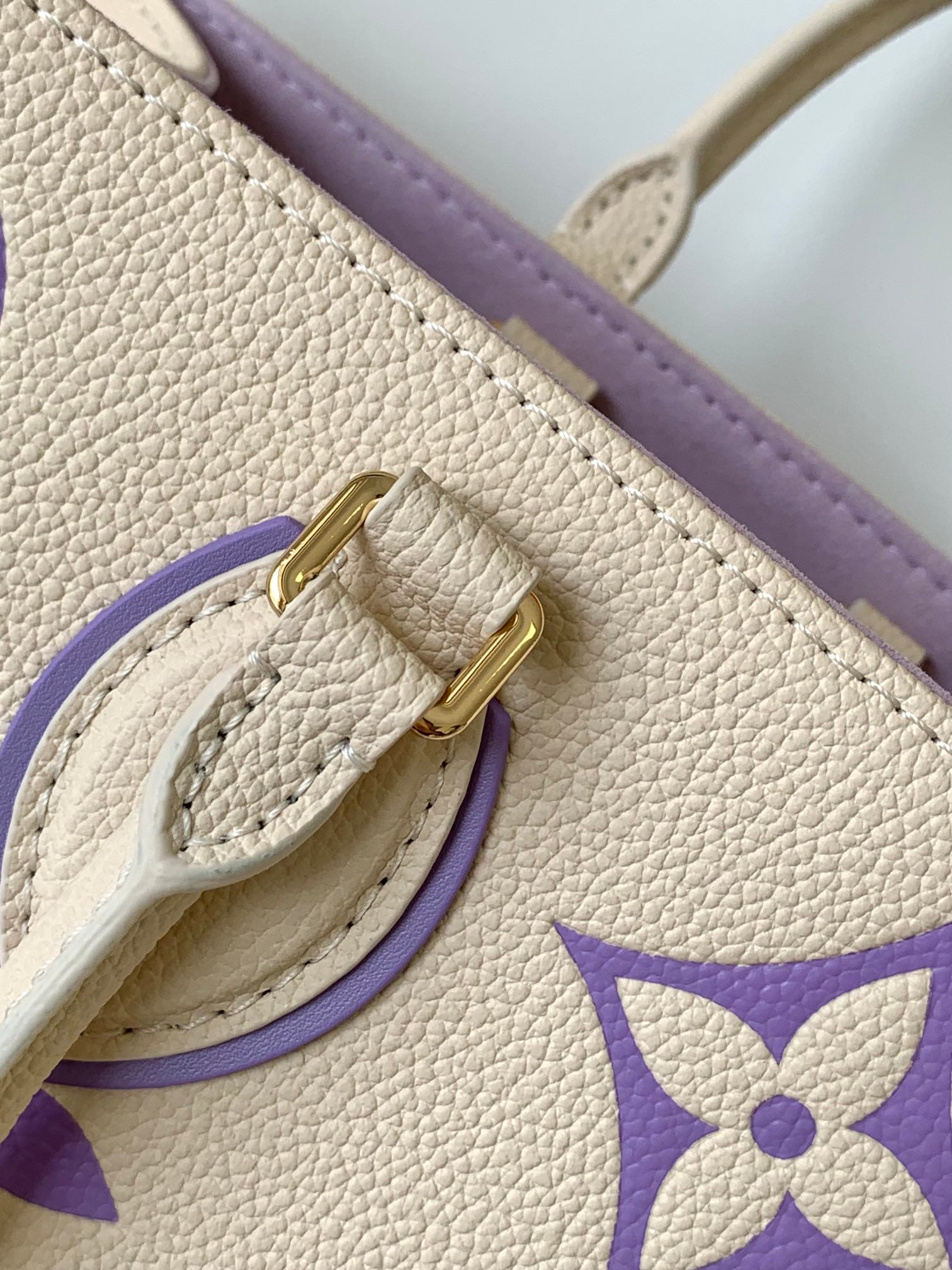Louis Vuitton Elegant Cream Leather Tote Bag with Purple Monogram Print