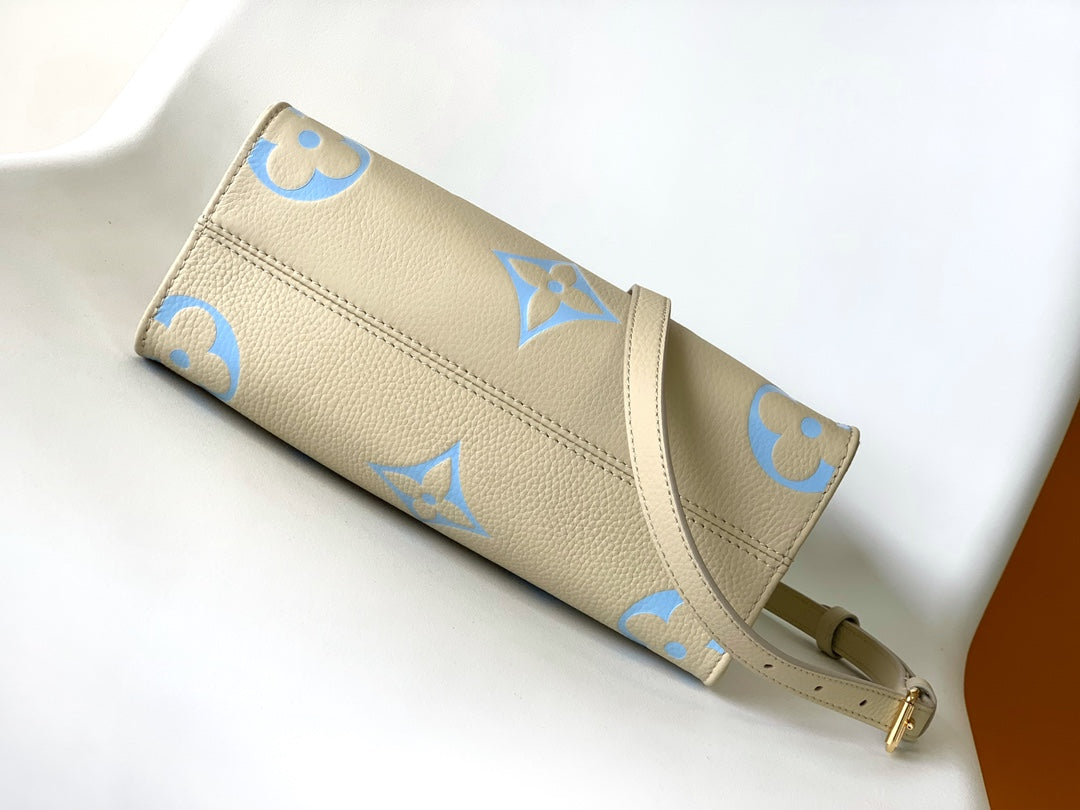 Louis Vuitton Chic Cream and Pastel Blue Monogram Embossed Leather Tote Handbag