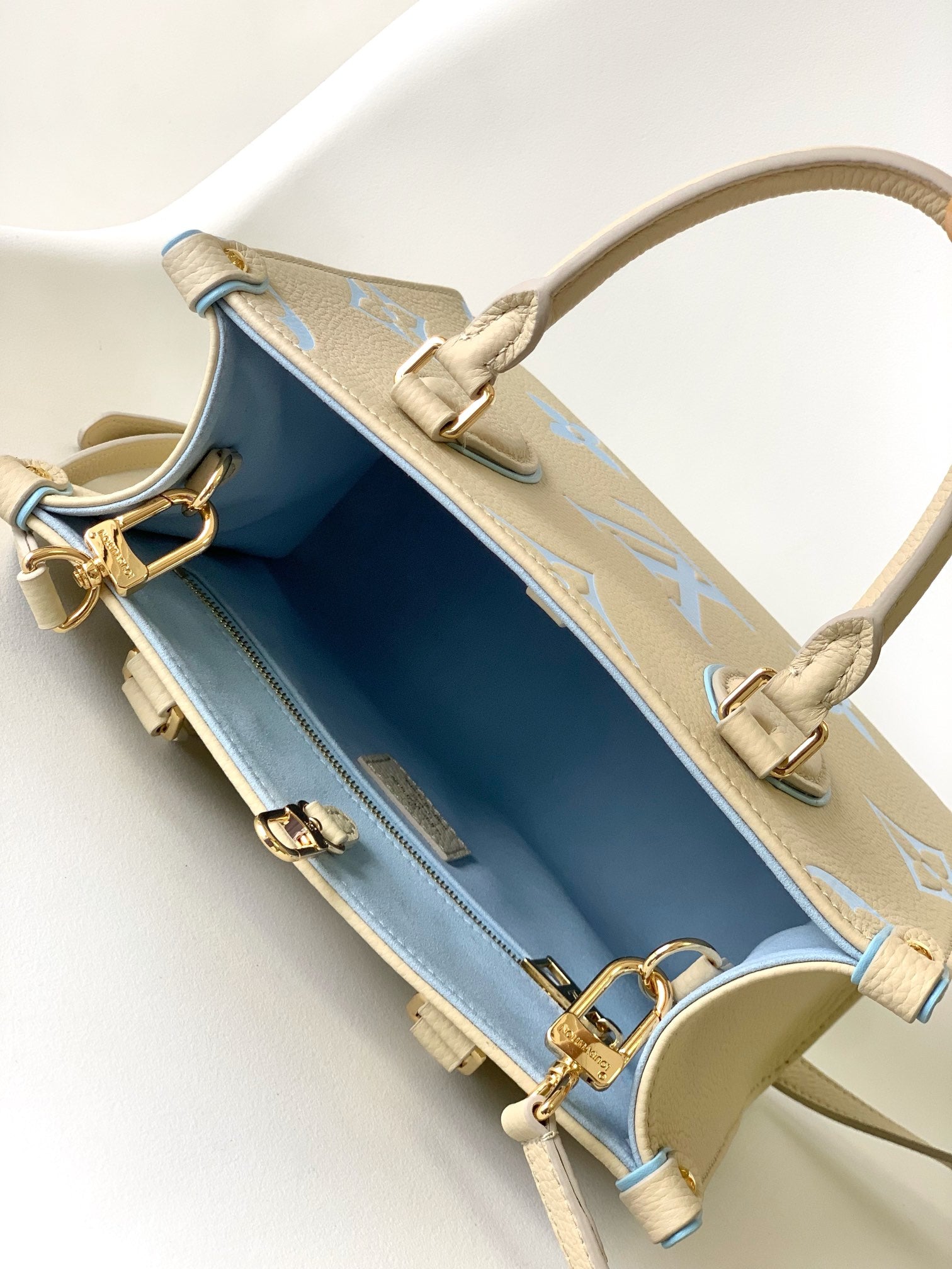 Louis Vuitton Chic Cream and Pastel Blue Monogram Embossed Leather Tote Handbag