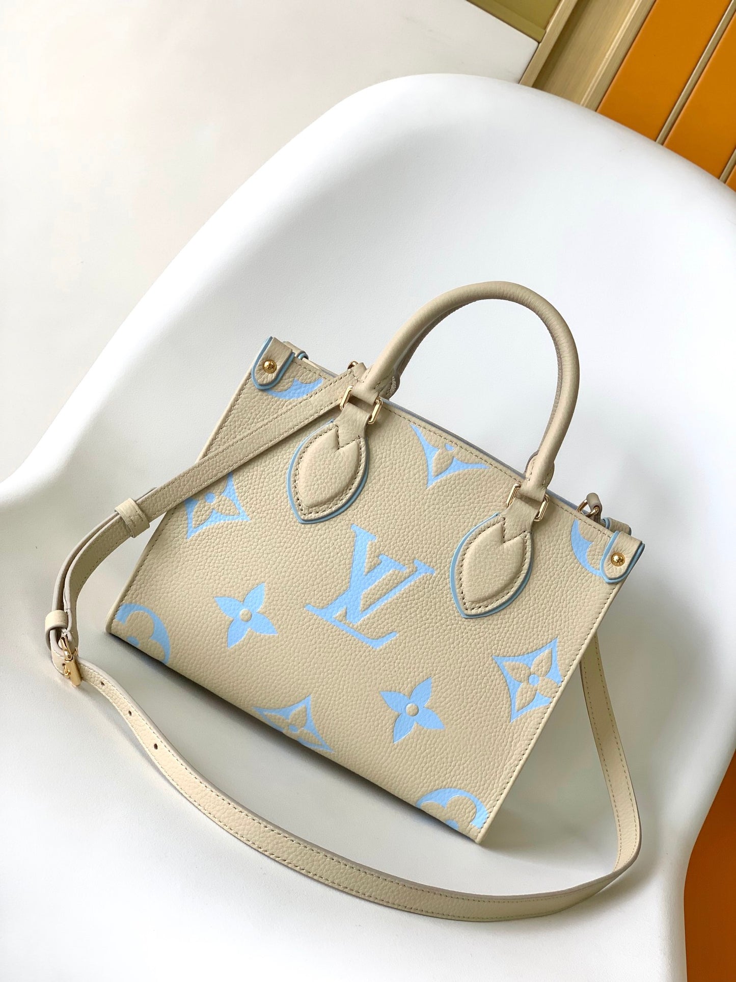Louis Vuitton Chic Cream and Pastel Blue Monogram Embossed Leather Tote Handbag