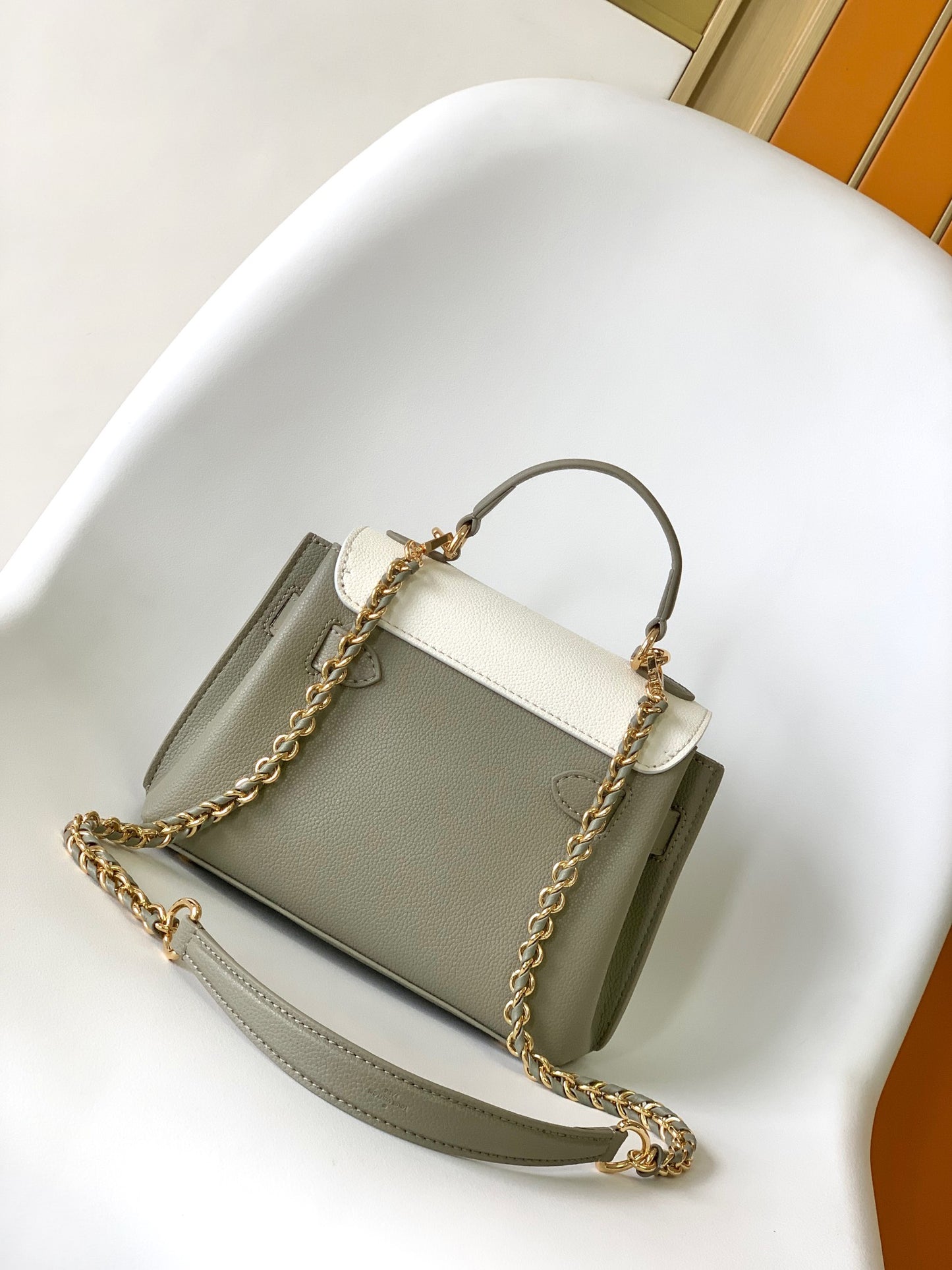 Louis Vuitton Elegant Sage Green and Cream Leather Top Handle Handbag with Gold Clasp