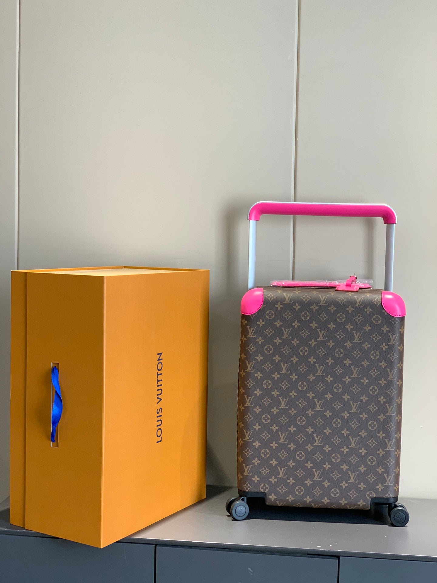 Brown Monogram Carry-On Suitcase with Hot Pink Handle and Wheels