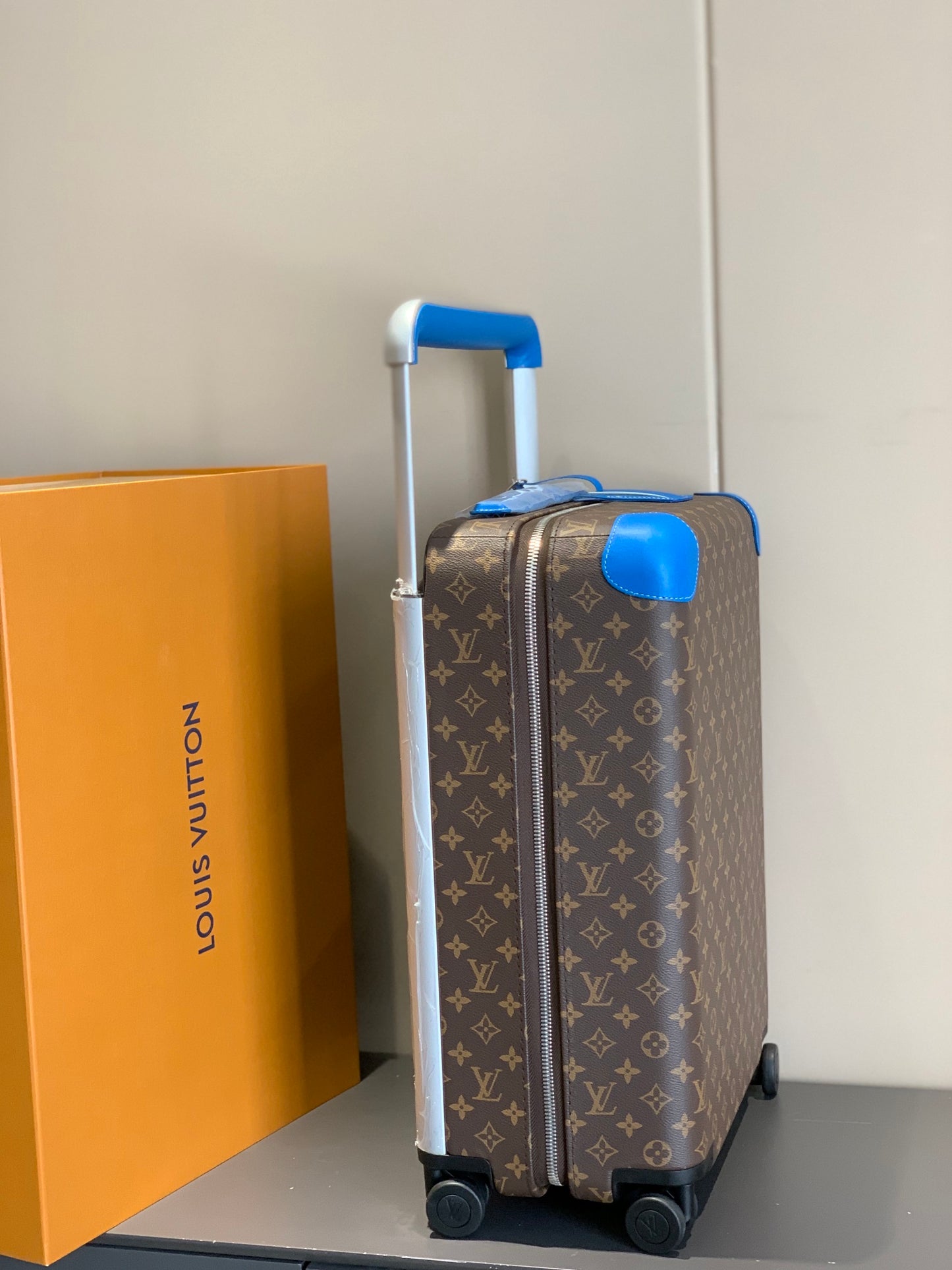Retro Brown Monogram Spinner Suitcase with Blue Leather Trim