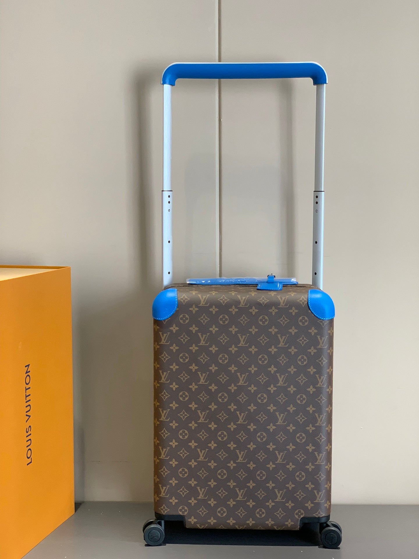 Retro Brown Monogram Spinner Suitcase with Blue Leather Trim