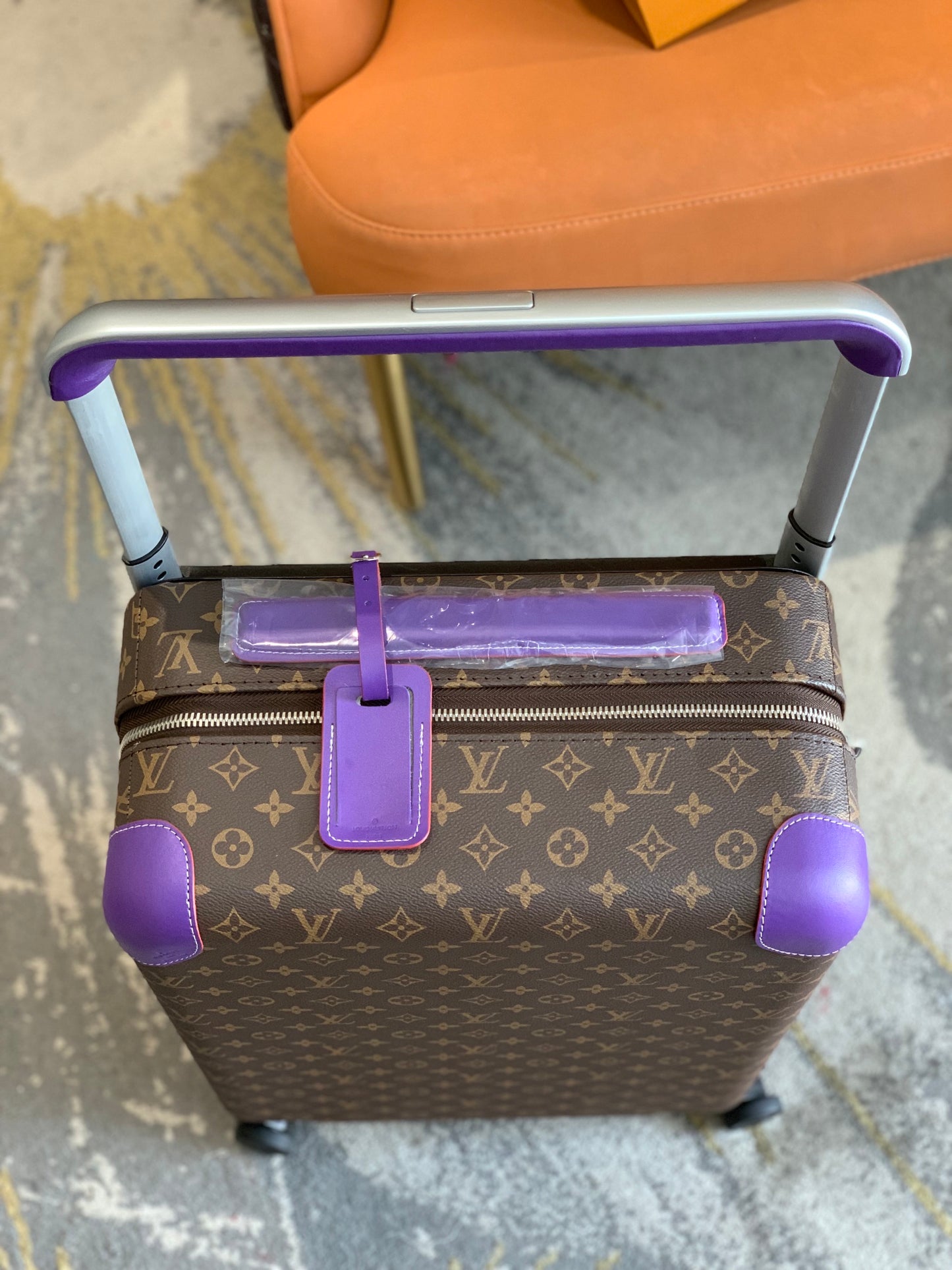 Luxury Brown Monogram Rolling Suitcase with Purple Accents
