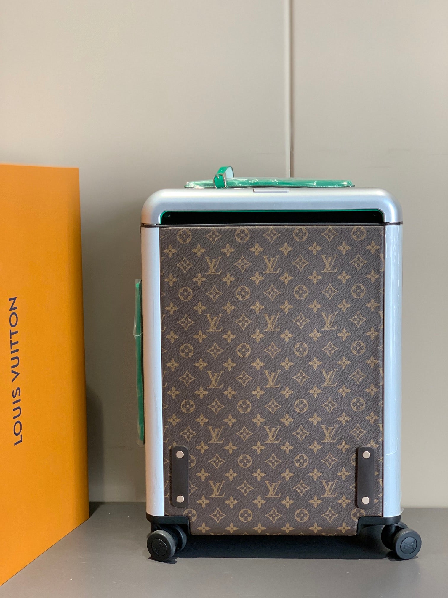 Brown Monogram Rolling Suitcase with Green Handle and Spinner Wheels