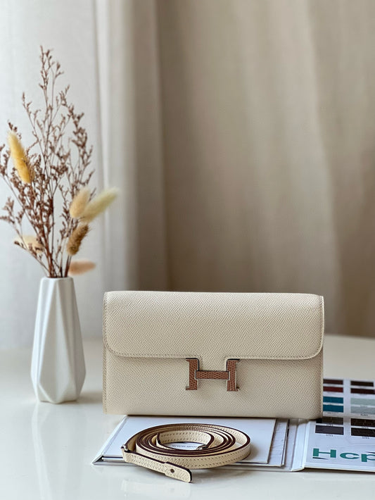Elegant Cream Leather Crossbody Bag with Gold H-Logo Clasp