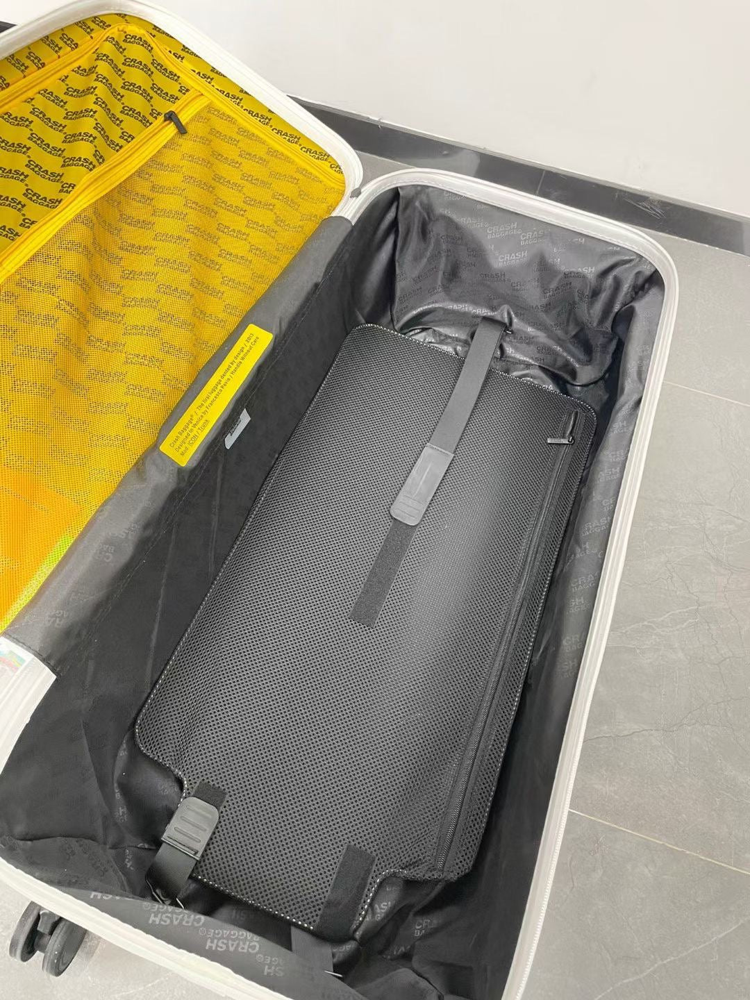 Modern Glossy White Dented Hardshell Spinner Suitcase