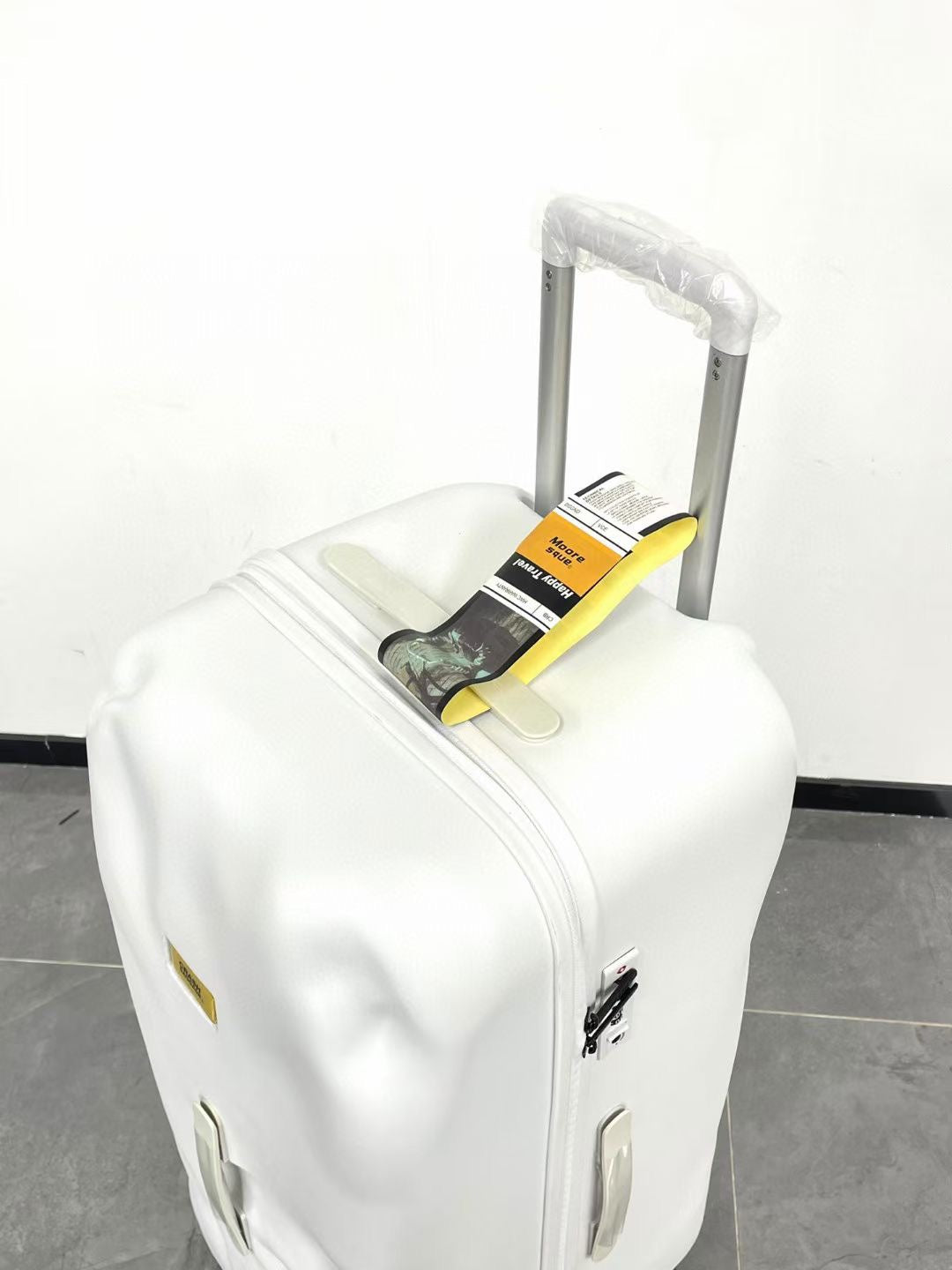 Modern Glossy White Dented Hardshell Spinner Suitcase