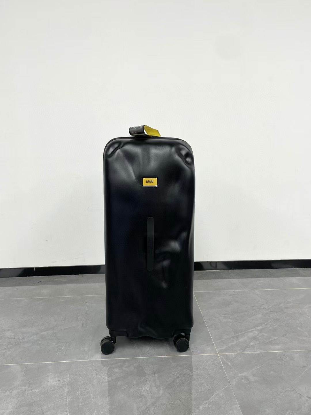 Black Spinner Carry-On Luggage with Yellow Accent Strap