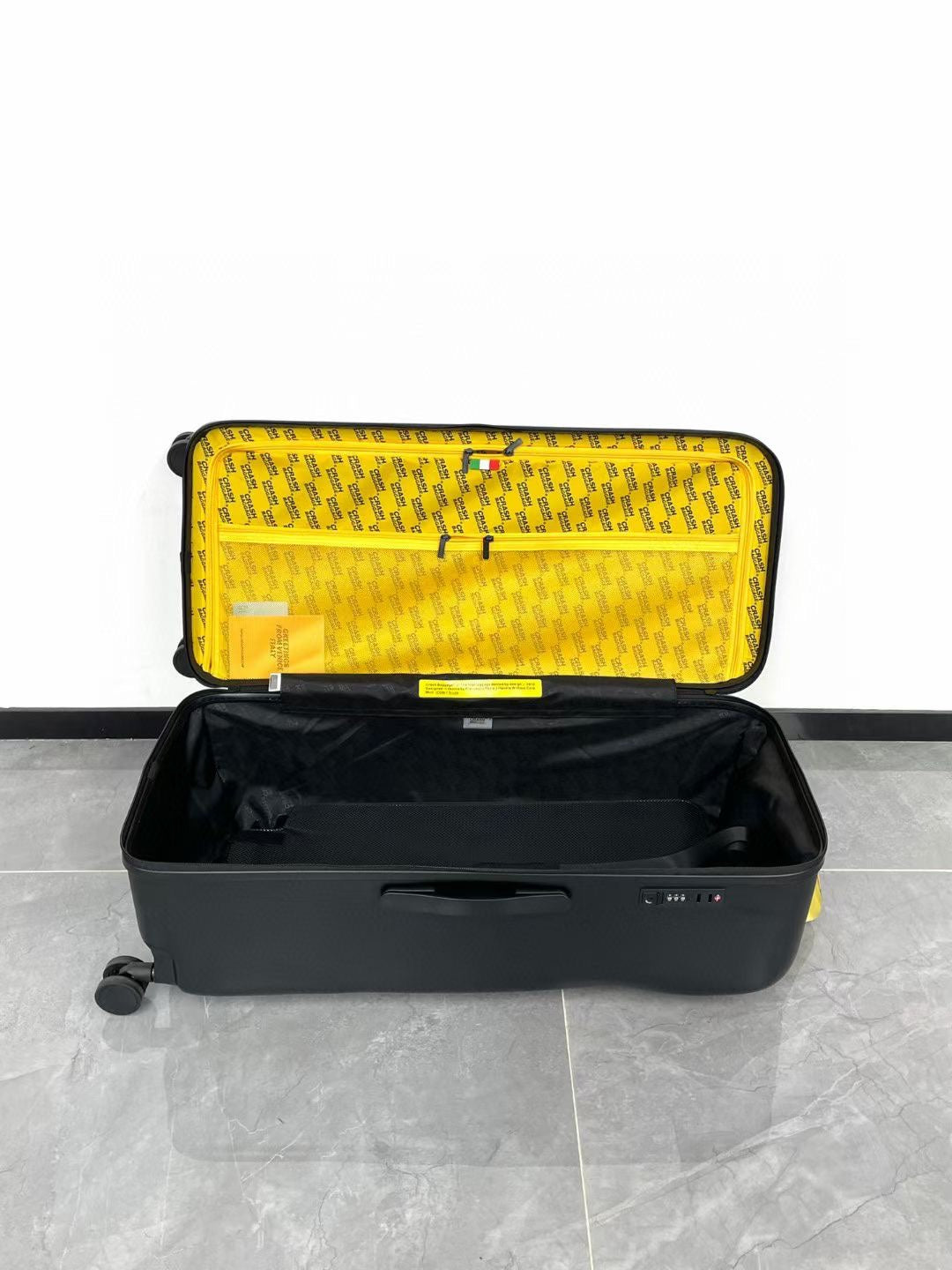 Black Spinner Carry-On Luggage with Yellow Accent Strap